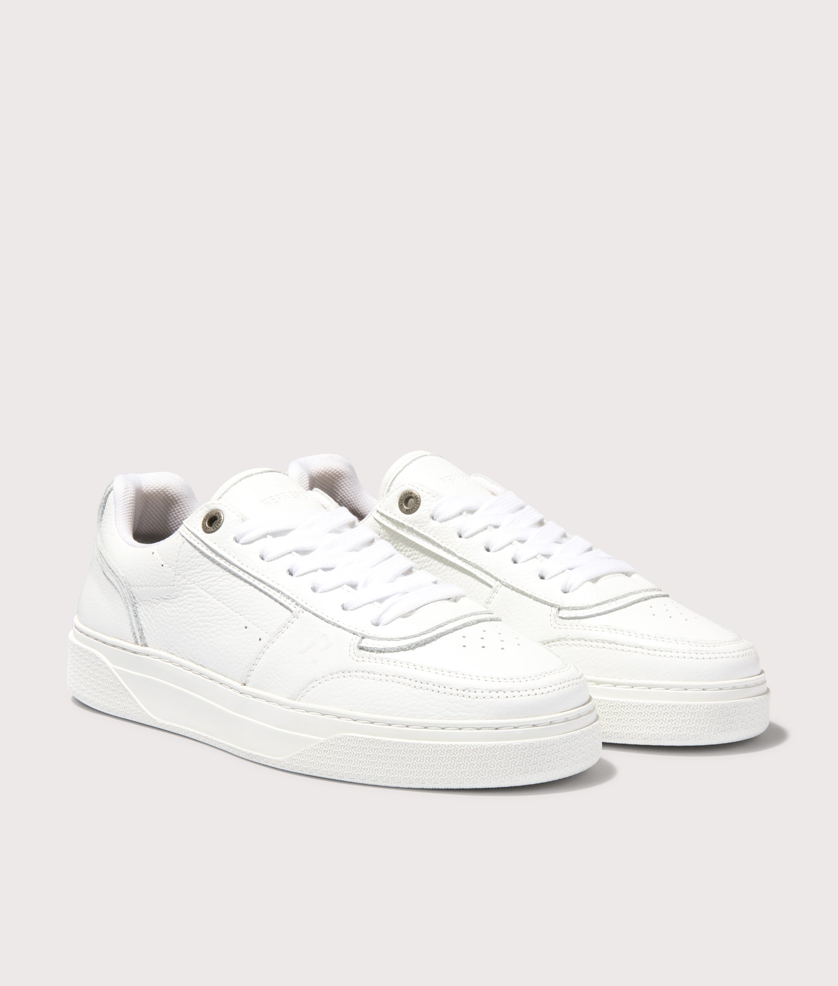 REPRESENT Initial Leather Sneakers in Flat White. Shot at EQVVS. Angle shot. 