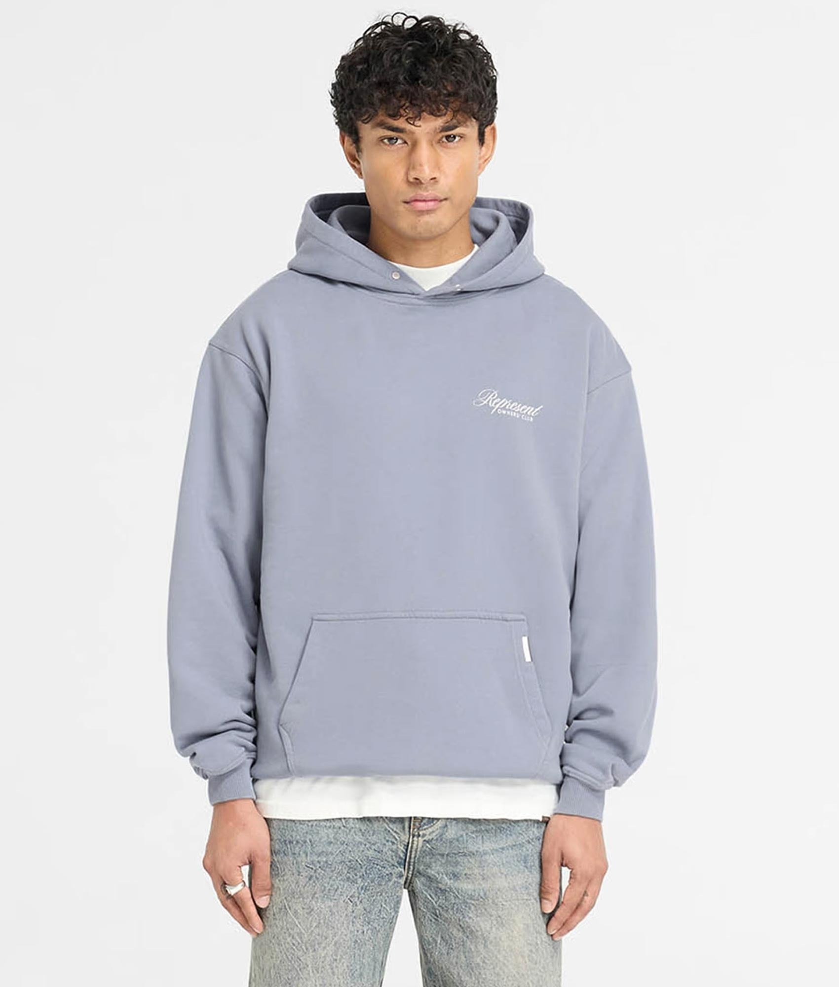 Represent Owners Club Script Hoodie. Shot by EQVVS. Front Model Shot.