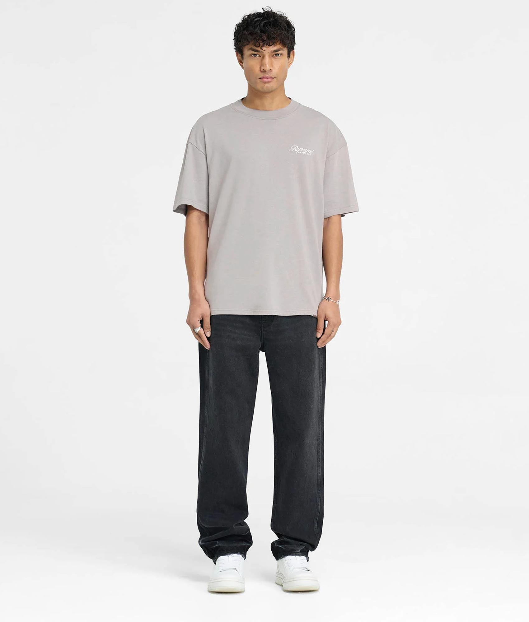 REPRESENT Oversized Represent Owners Club Script T-Shirt in Slate at EQVVS Menswear. Model full front shot.