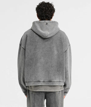 Initial Boxy Hoodie. Shot by EQVVS. Back model shot.