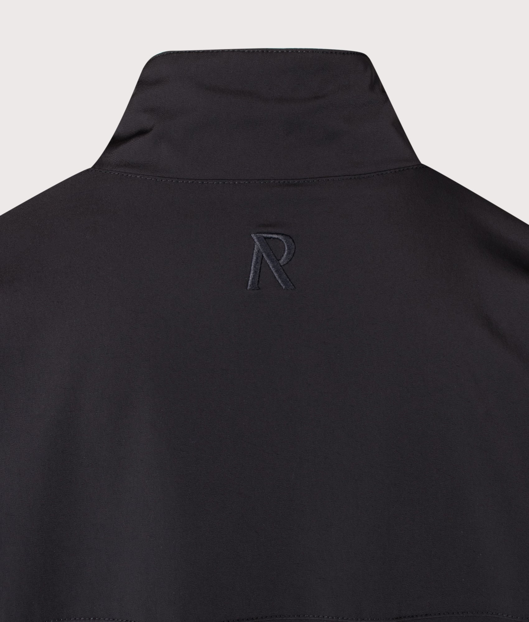 Represent Oversized Initial Nylon Track Jacket in Jet Black at EQVVS Menswear. Detail shot.