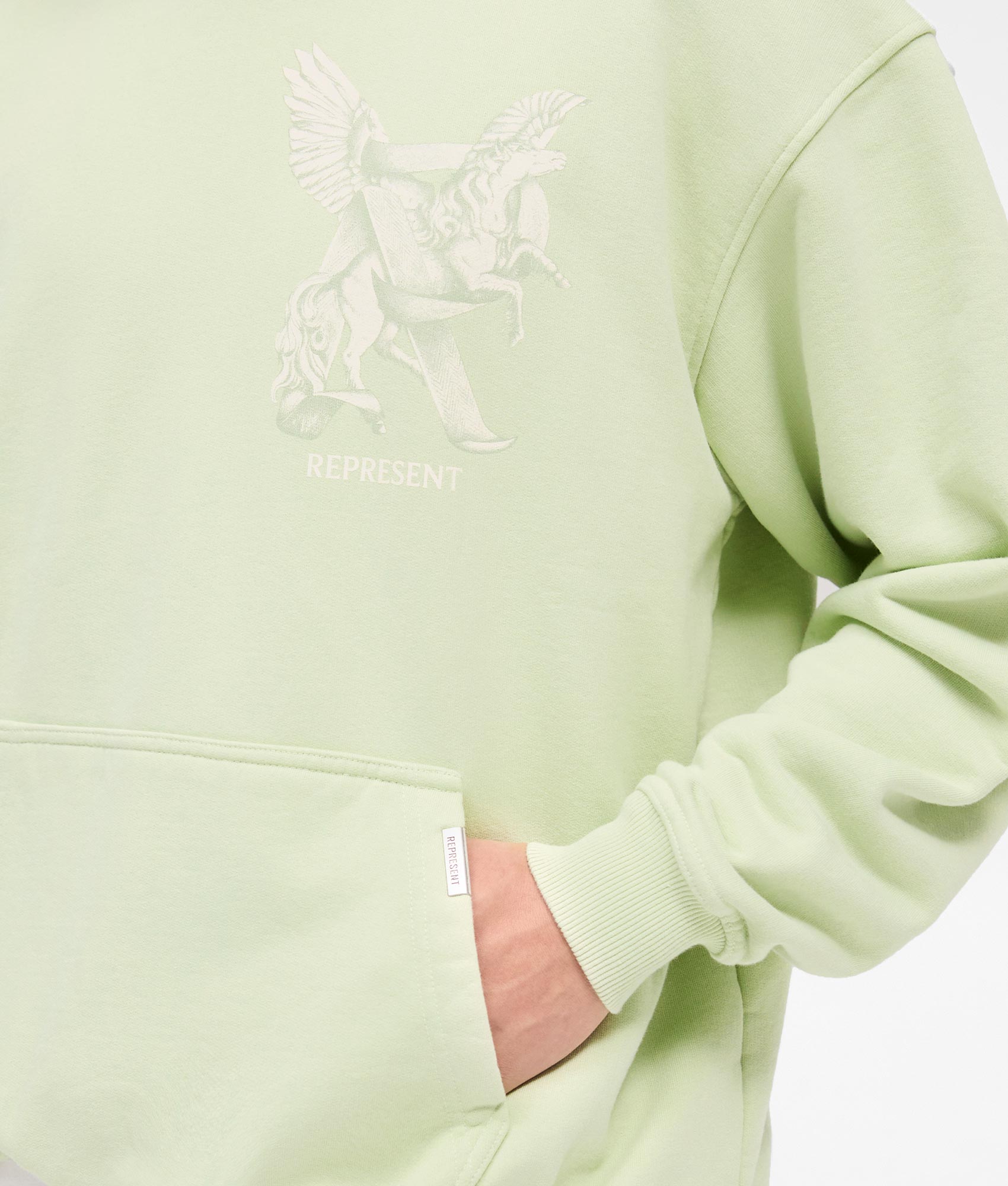 REPRESENT Elegance In Motion Hoodie in Matcha. Shot at EQVVS.  Detail shot. 