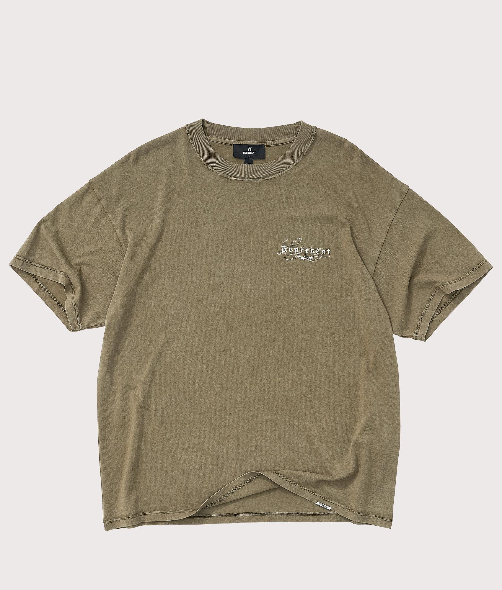 Legacy T-Shirt by Represent in Aged Khaki. Shot by EQVVS. Front flat shot.