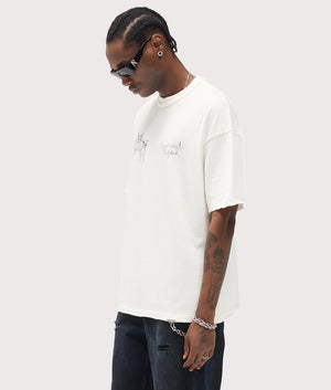 Relaxed Fit Hand Drawn Thoroughbred Dogs T-Shirt in Washed Ecru . 100% Cotton | REPRESENT | EQVVS | Front model shot 