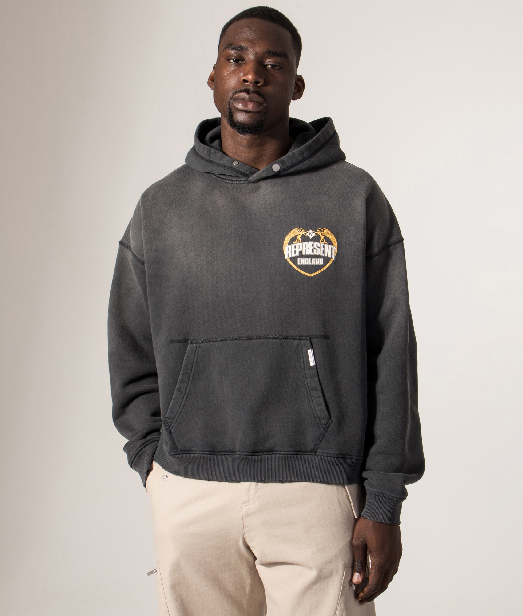 Represent Angel Border Hoodie by Represent in Stained Black. Shot by EQVVS. Front model shot.