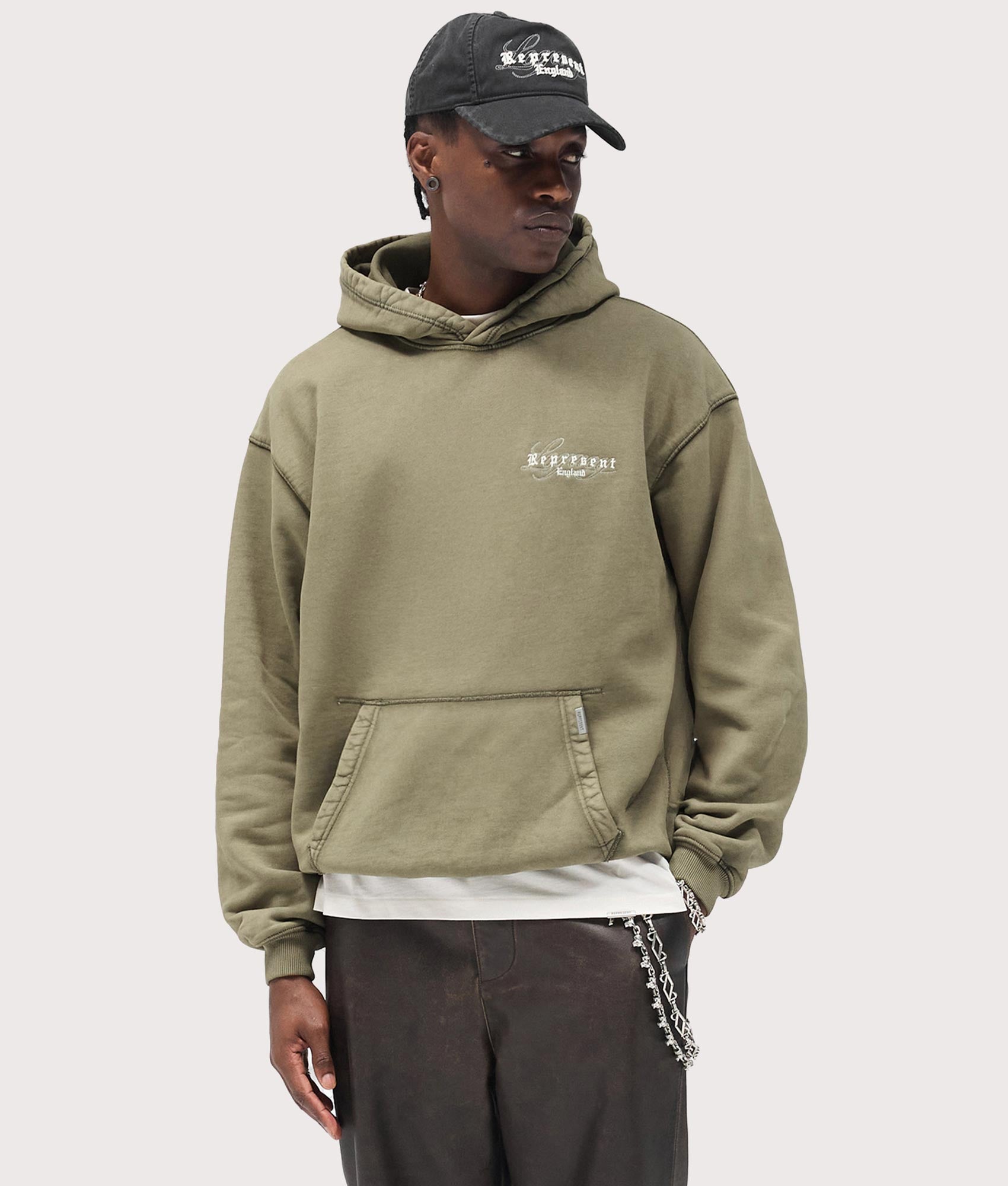 Legacy Hoodie by Represent in Aged Khaki. Shot by EQVVS. Front model shot.