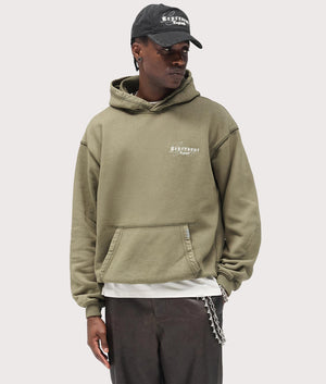 Legacy Hoodie by Represent in Aged Khaki. Shot by EQVVS. Front model shot.