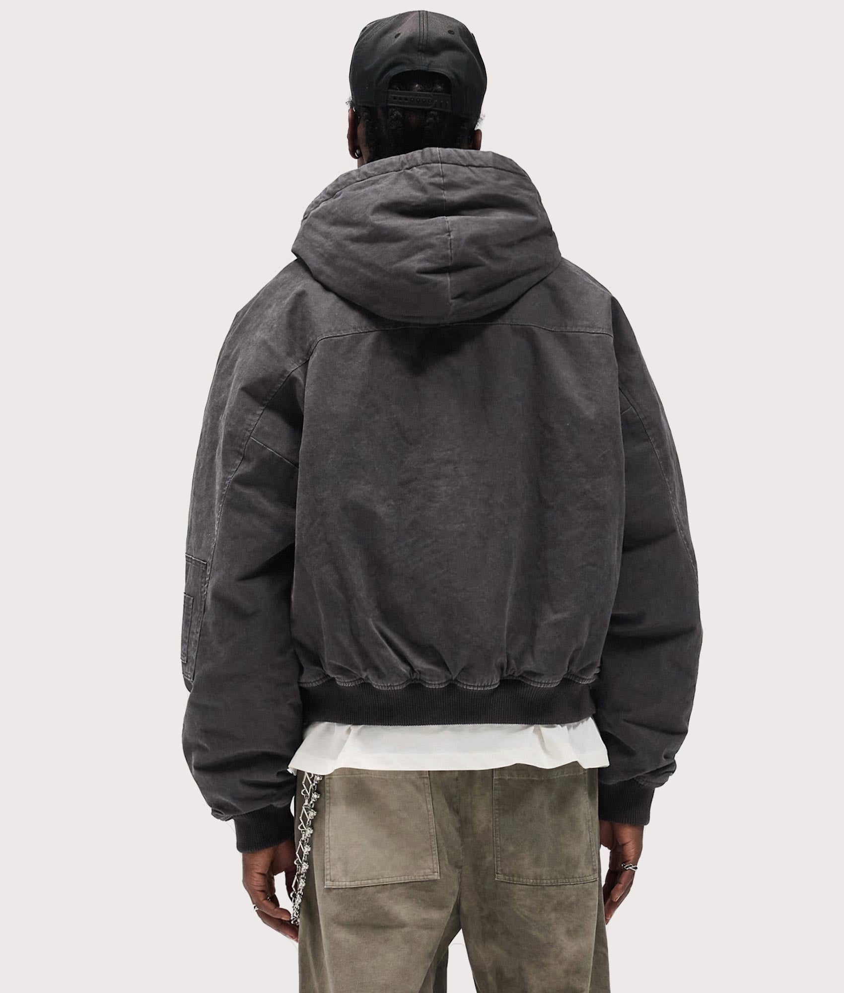 Hooded Bomber Jacket by Represent in Washed Black. Shot by EQVVS. Back model shot.