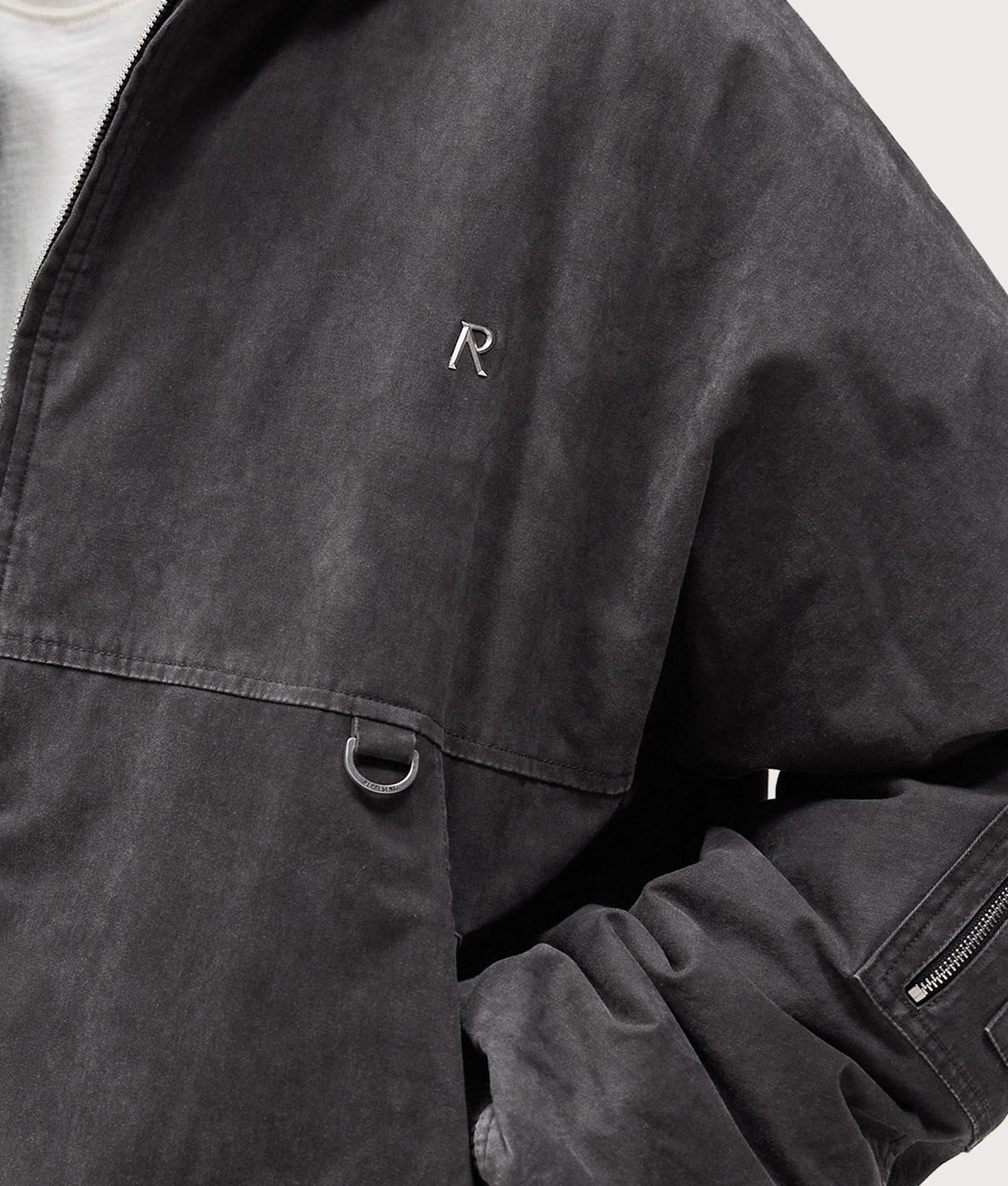 Hooded Bomber Jacket by Represent in Washed Black. Shot by EQVVS. Detail model shot.