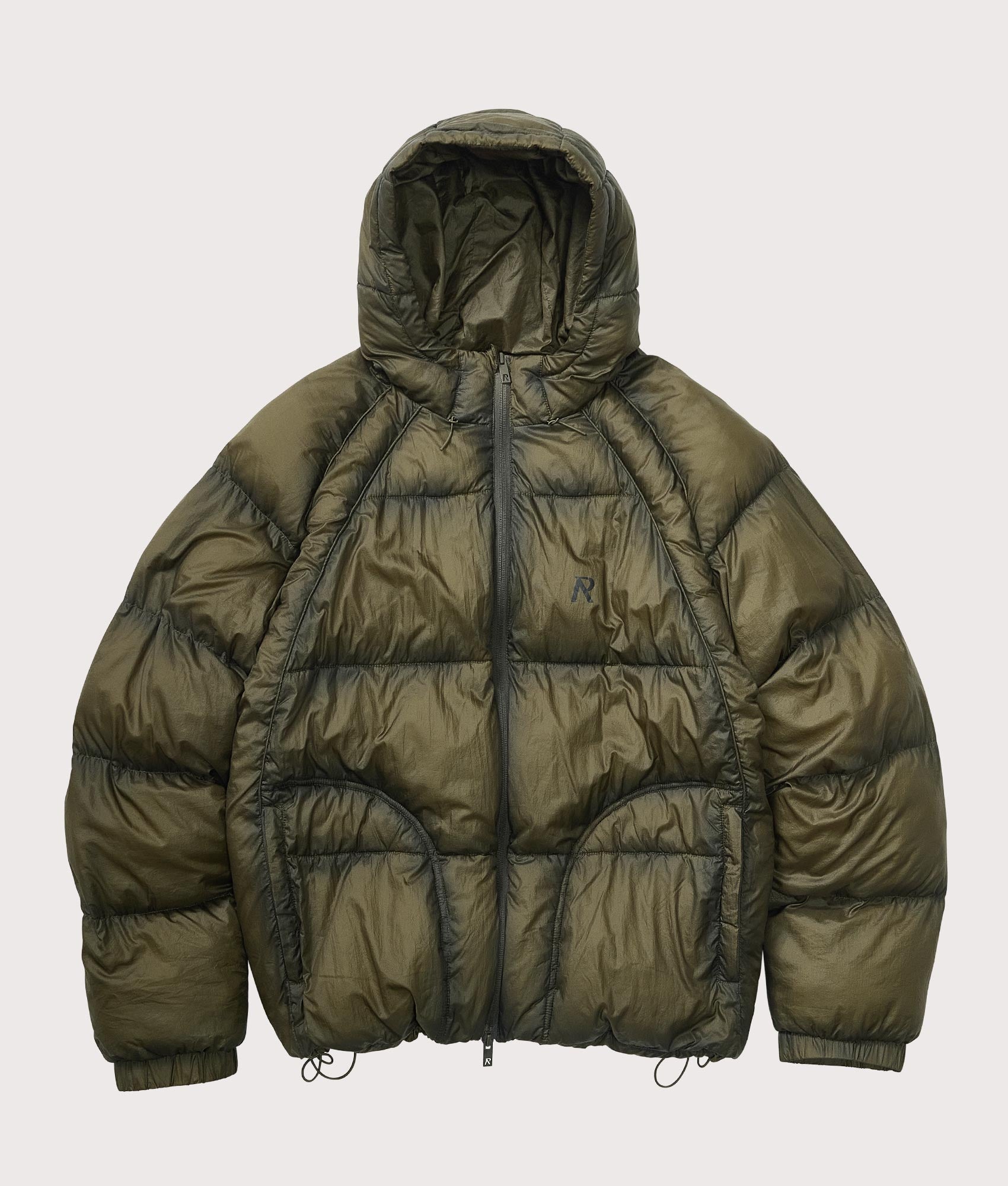 Represent Translucent Hooded Puffer Coat in Washed Olive at EQVVS Menswear. Flat shot.