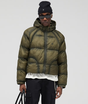 Translucent Hooded Puffer Coat by Represent in Washed Olive. Shot by EQVVS. Front model shot.
