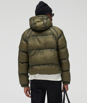 Translucent Hooded Puffer Coat by Represent in Washed Olive. Shot by EQVVS. Back model shot.