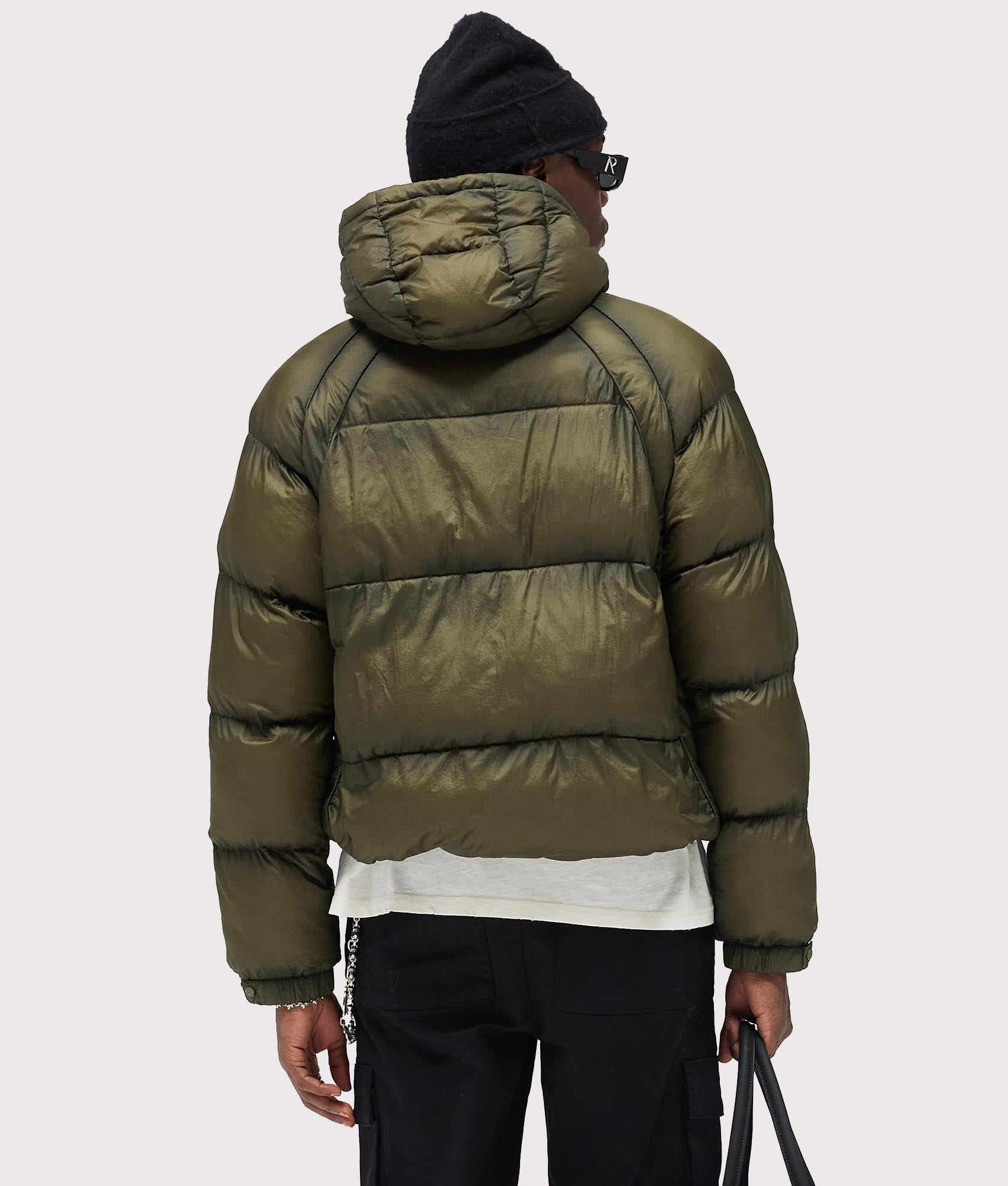 Represent Translucent Hooded Puffer Coat in Washed Olive at EQVVS Menswear. Back shot.