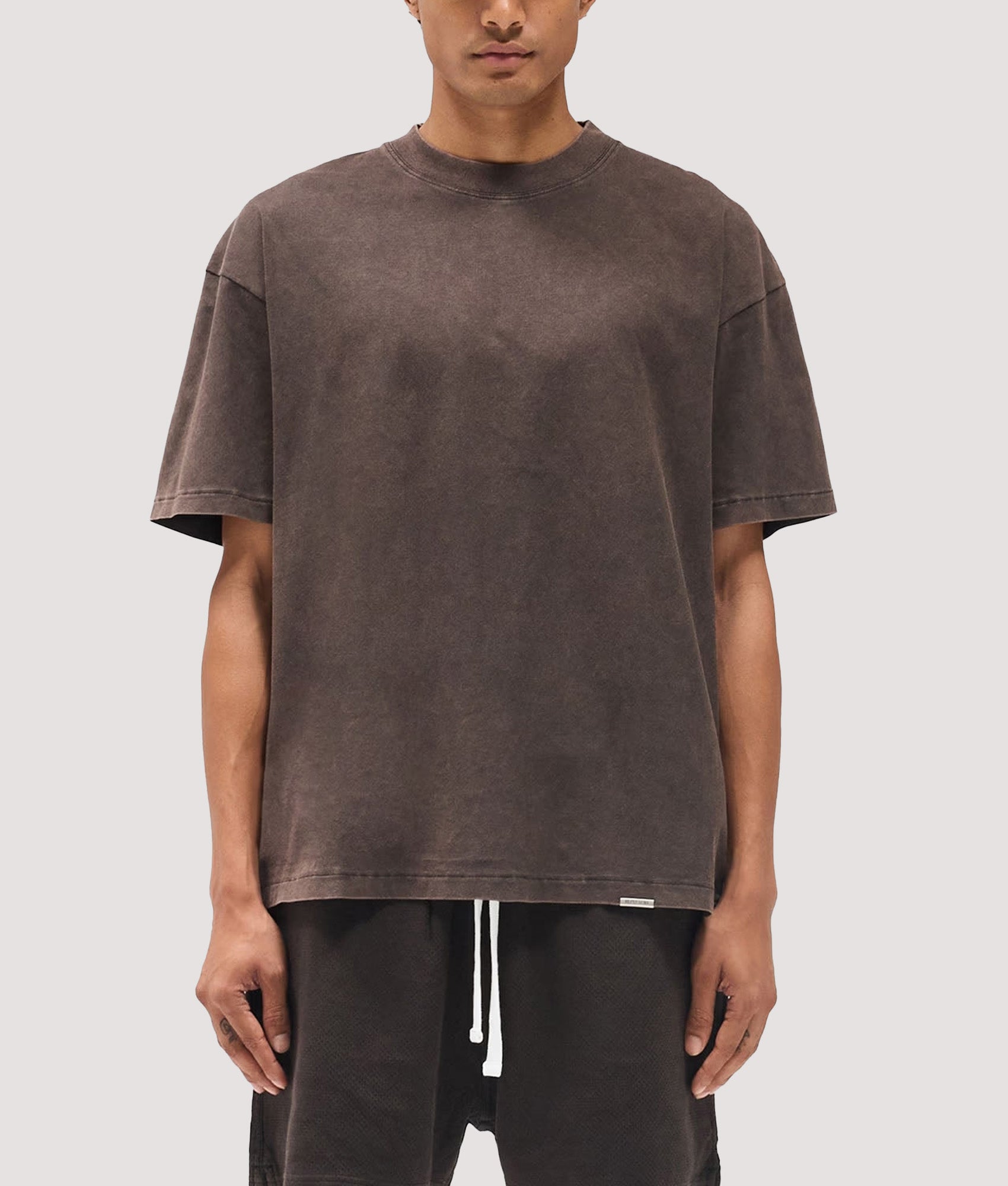 Represent Oversized Initial T-Shirt in  Coffee at EQVVS Menswear. Model front shot.