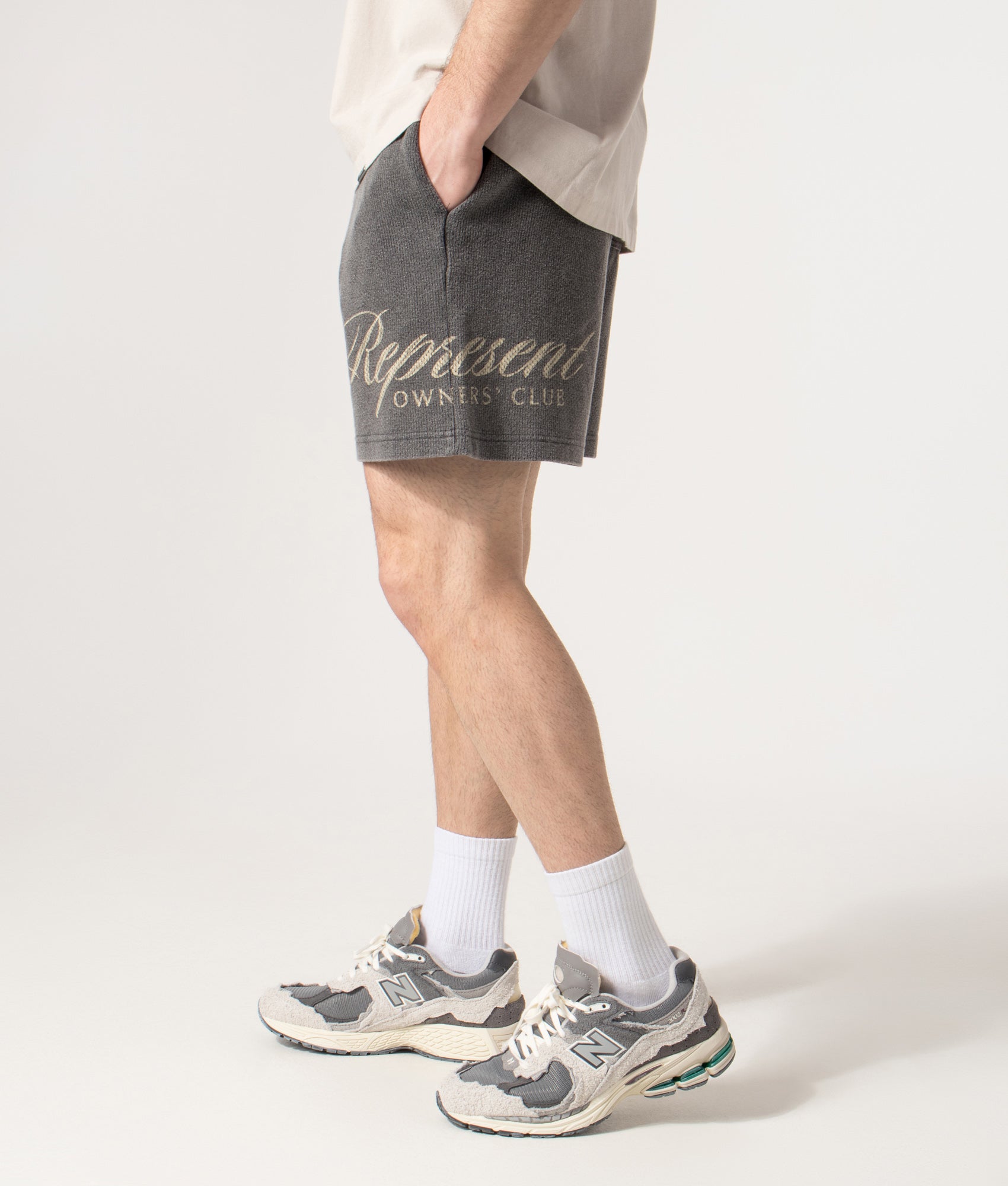 Owners’ Club Script Shorts in Vintage Grey | 100% Cotton | REPRESENT | EQVVS | Side detail model shot 