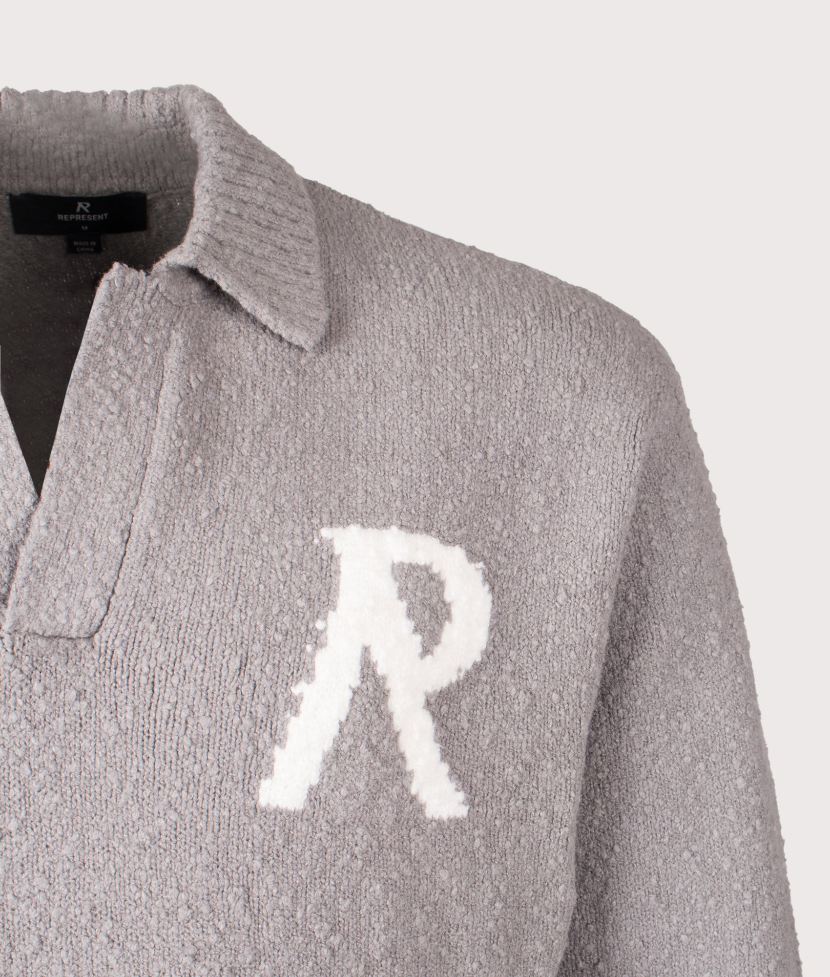 REPRESENT Knitted Boucle Long Sleeve Polo Shirt in Grey at EQVVS Menswear. Detail shot.