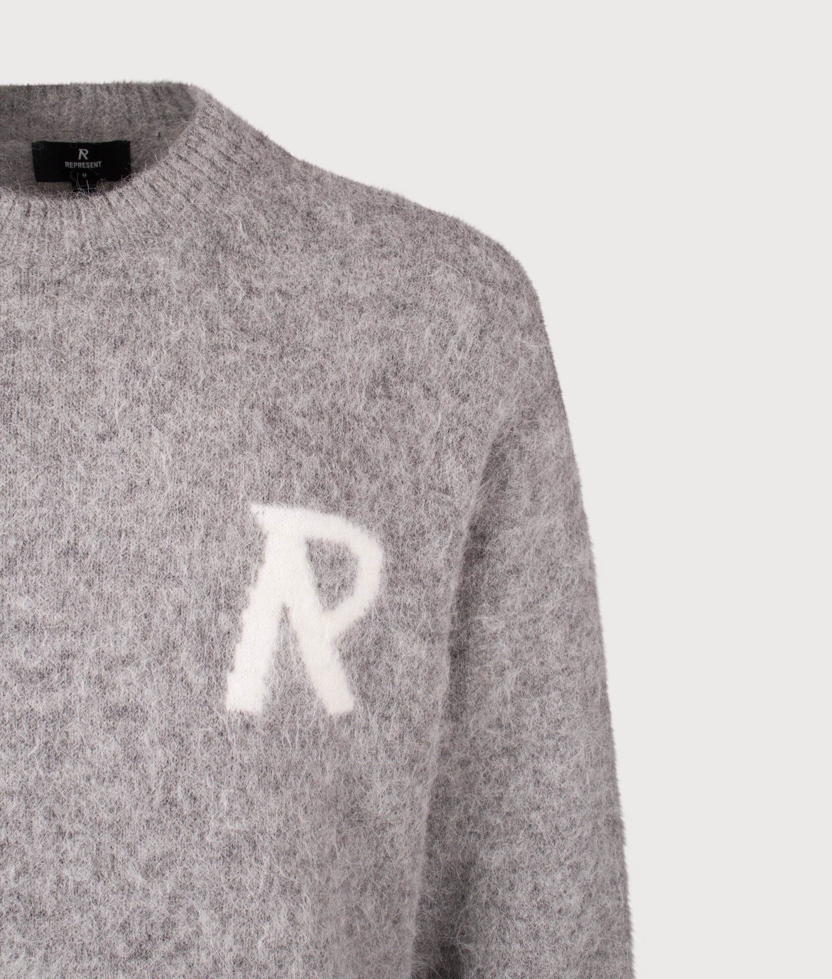 REPRESENT Logo Knit Sweatshirt in  Grey at EQVVS menswear. Detail shot.