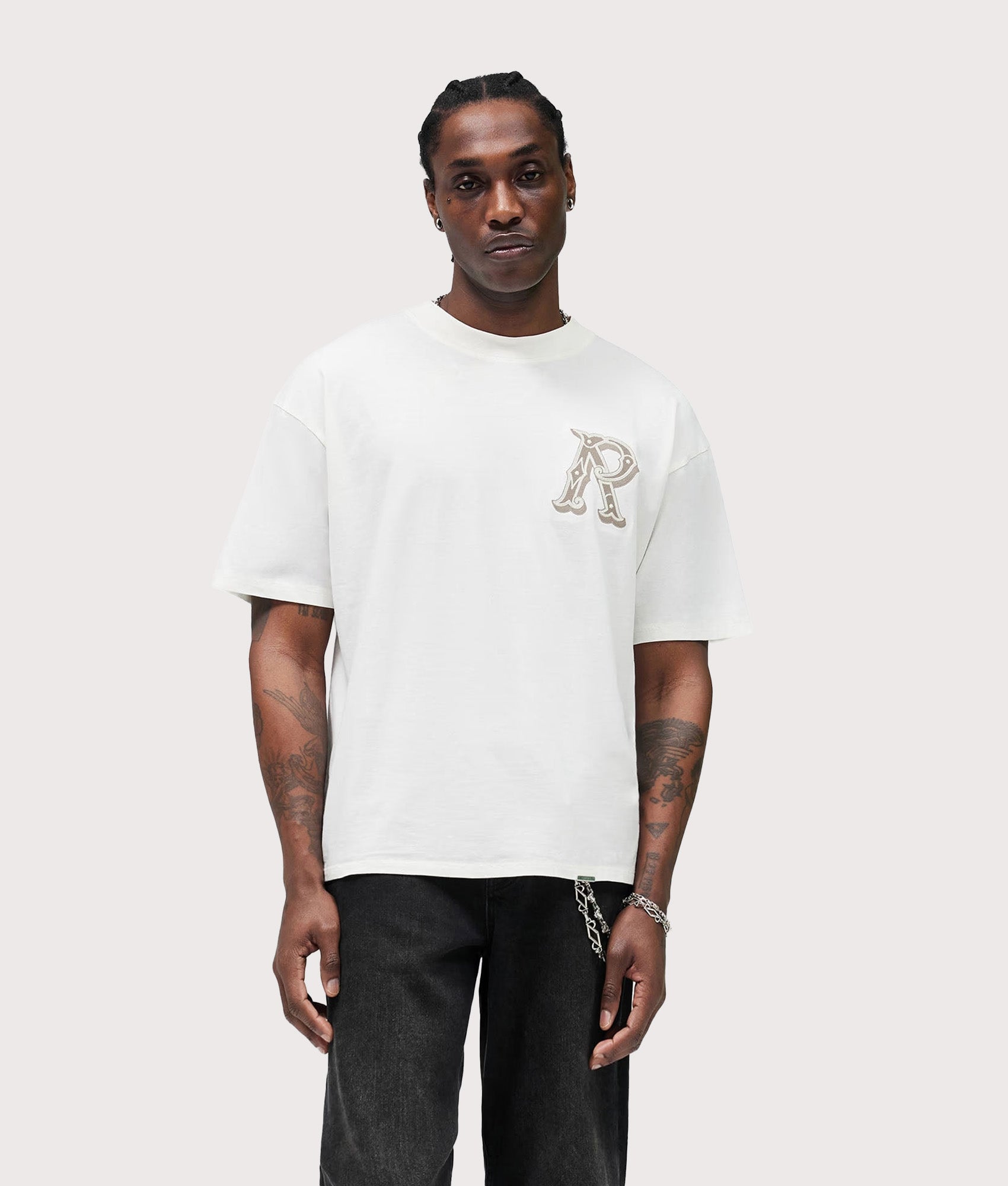 Represent Western Initial T-Shirt in Flat White at EQVVS Menswear. Model front shot.