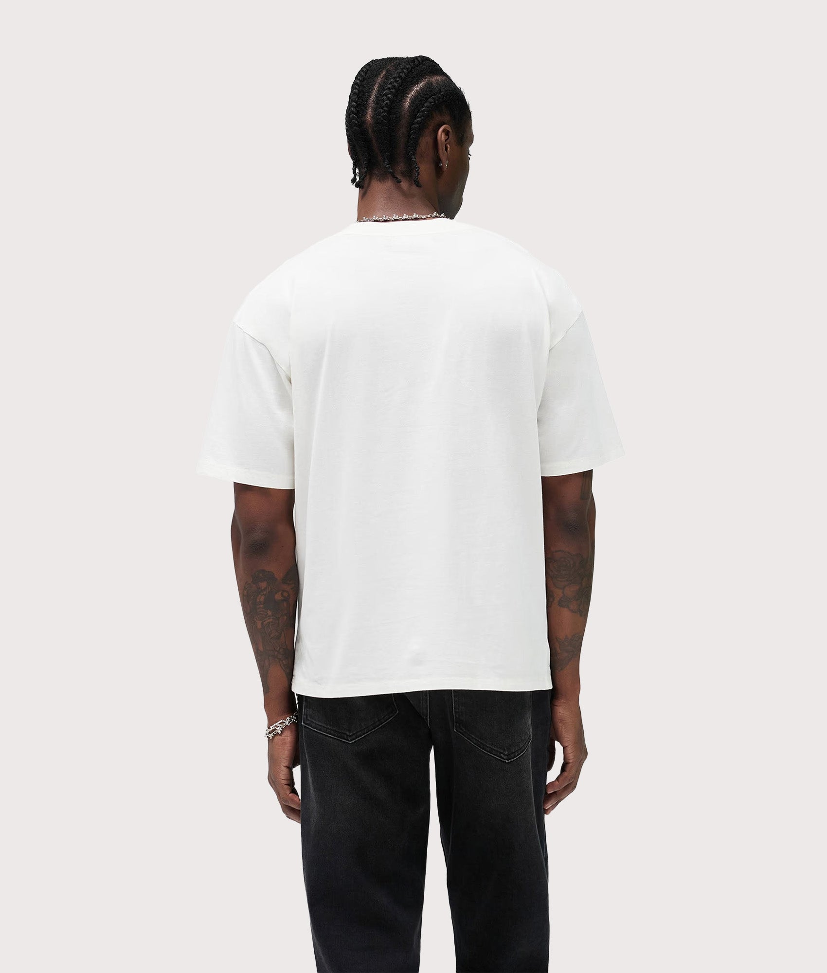 Represent Western Initial T-Shirt in Flat White at EQVVS Menswear. Model back shot.