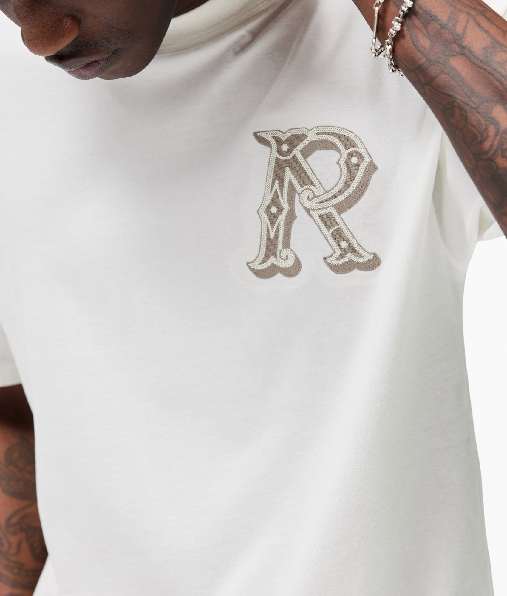 Represent Western Initial T-Shirt in Flat White at EQVVS Menswear. Detail shot.