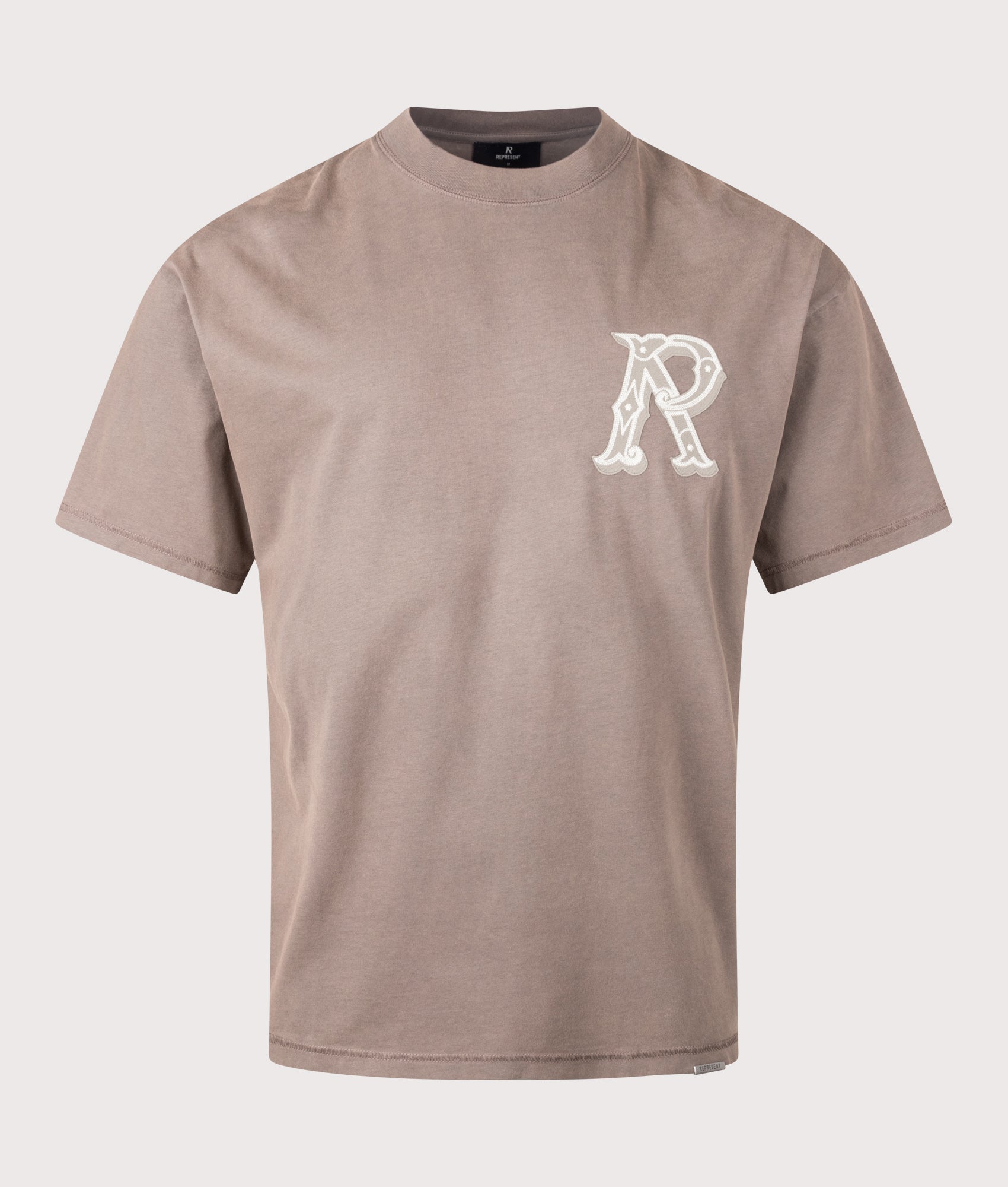 REPRESENT Oversized Fit Western Initial T-Shirt in Dusty Brown at EQVVS Menswear. Front shot.