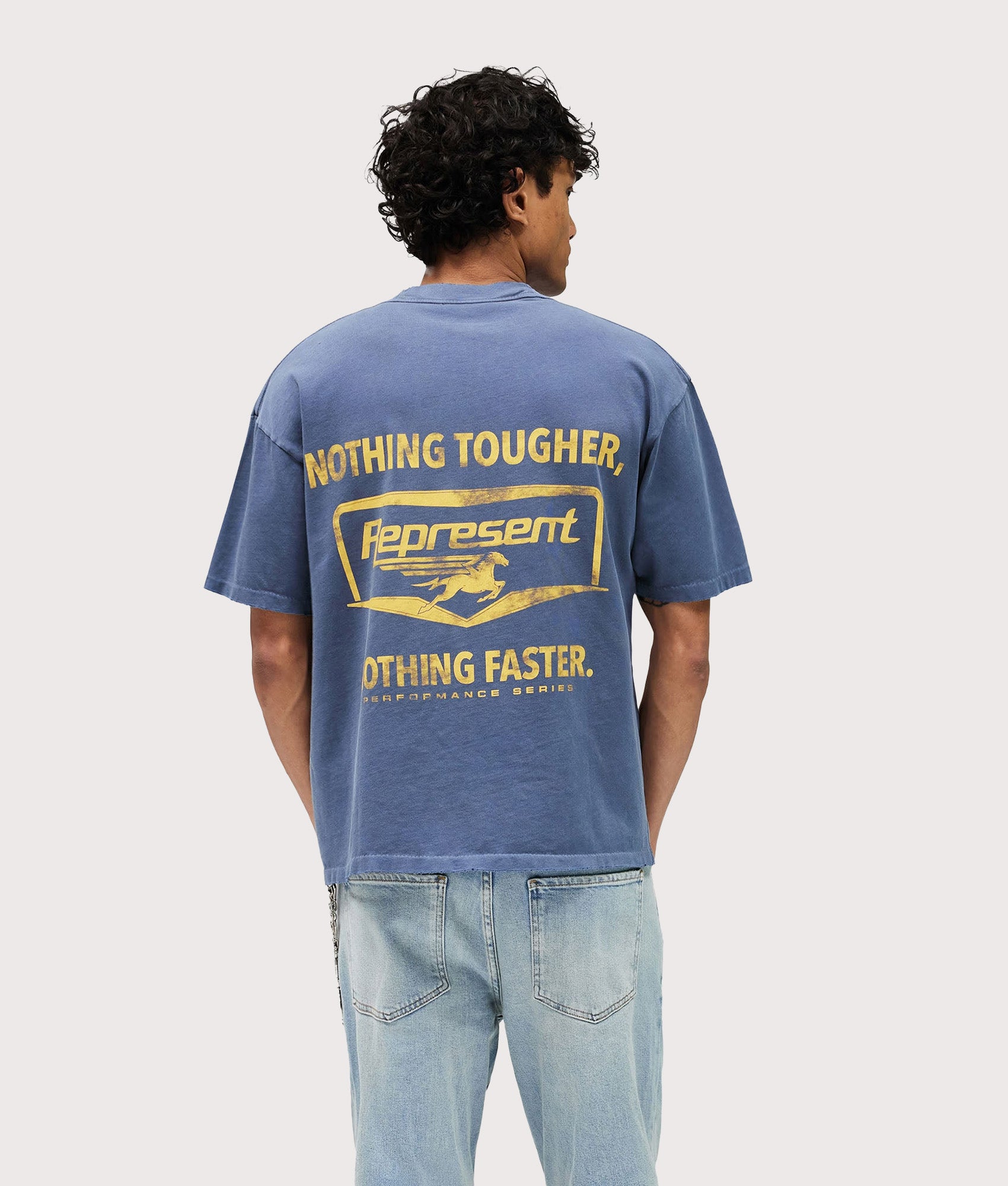 Represent Nothing Faster T-Shirt in Indigo at EQVVS Menswear. Model back shot.