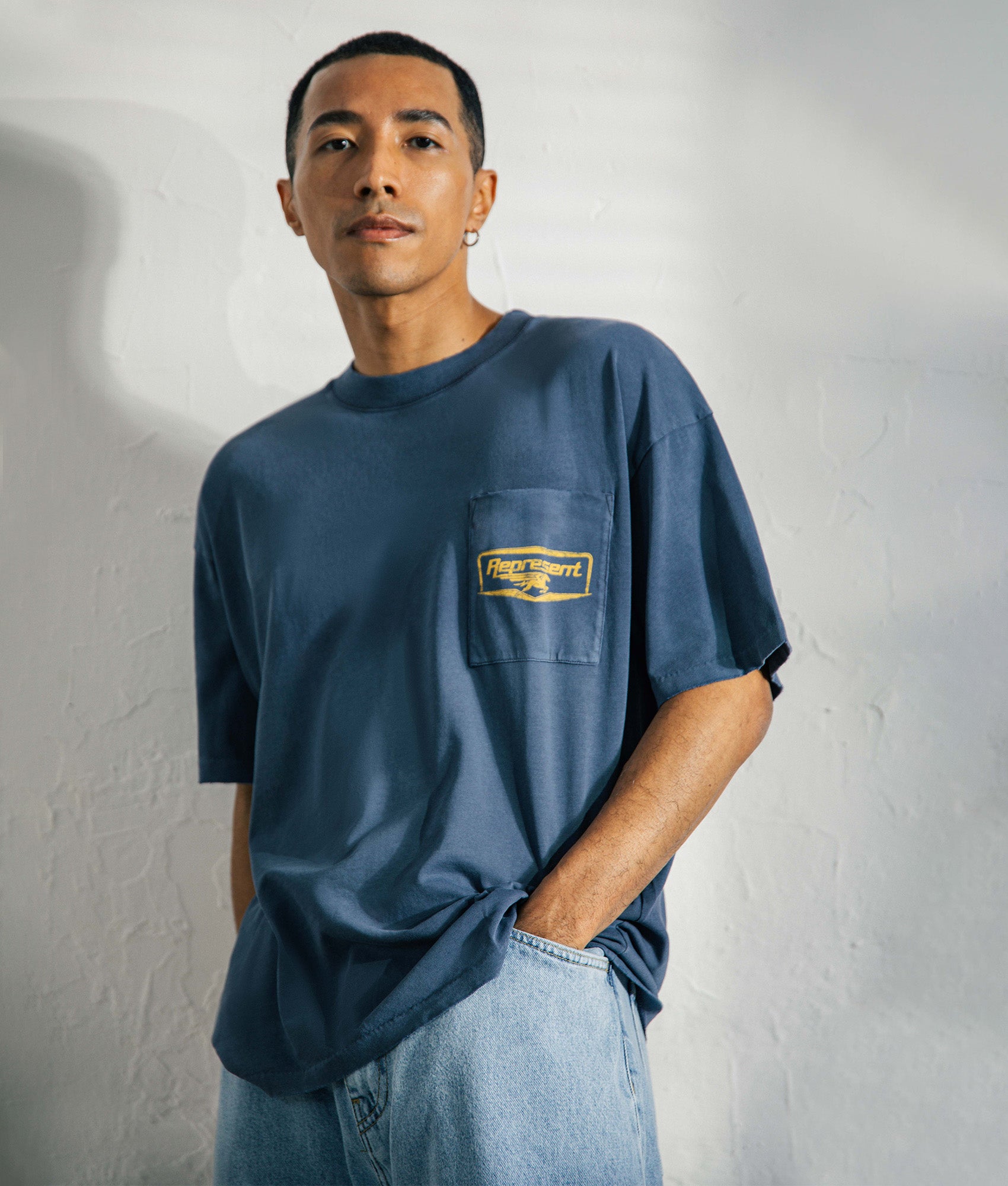Represent Nothing Faster T-Shirt in Indigo at EQVVS Menswear. Model front shot.