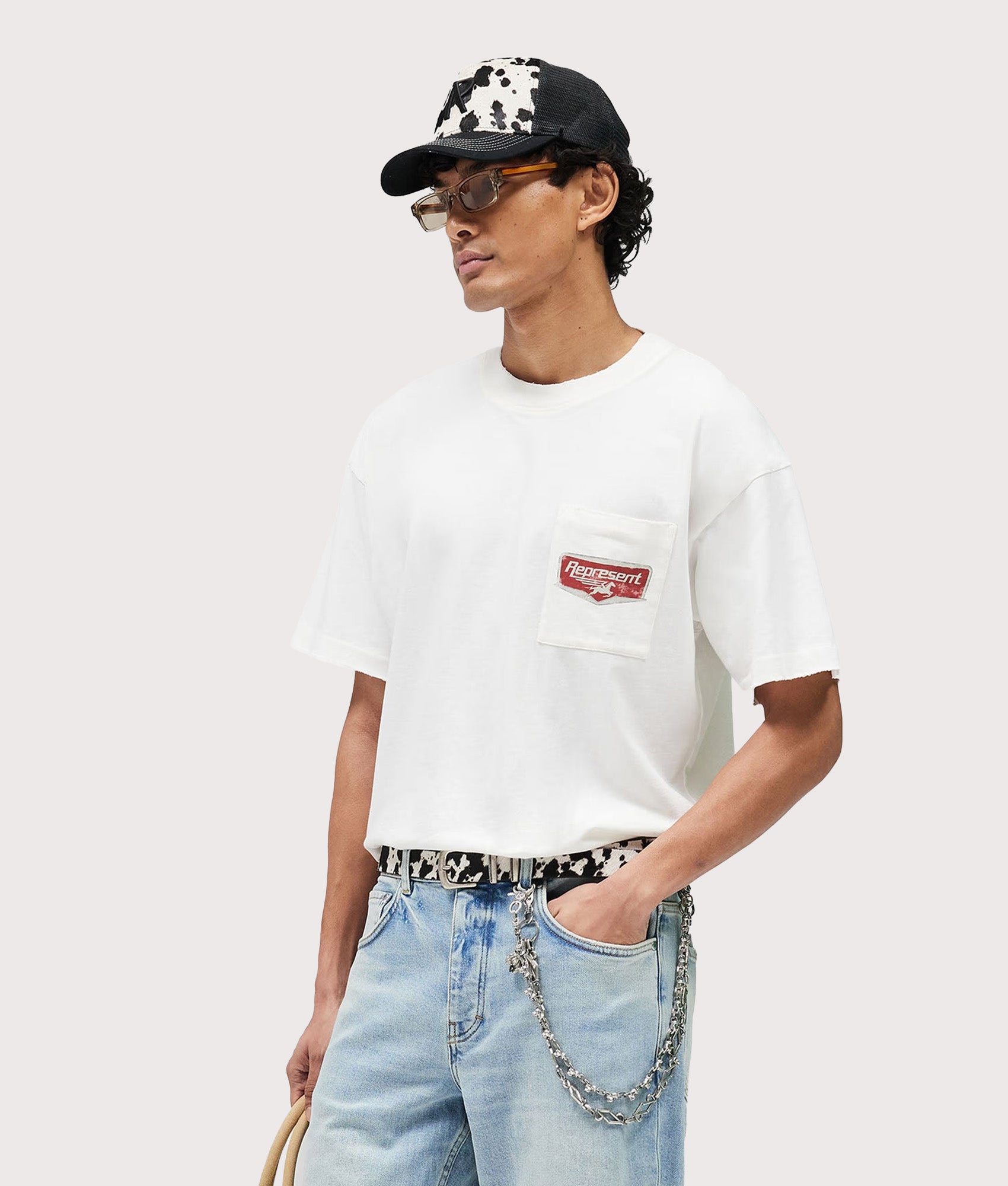 Represent Oversized Fit Nothing Faster T-Shirt in Flat White at EQVVS Menswear. Model front shot.