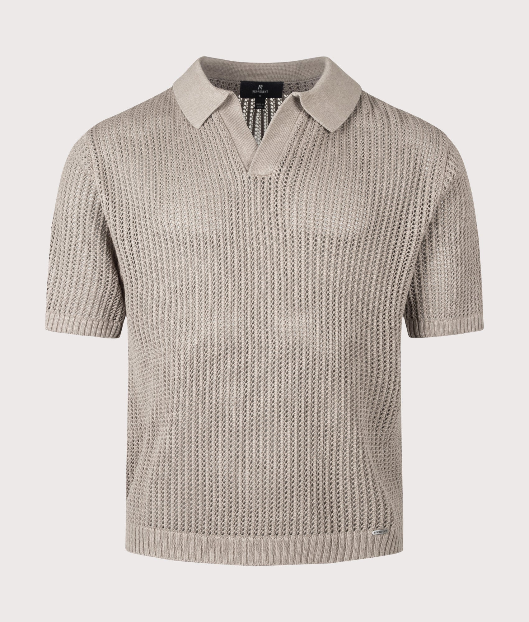 REPRESENT Beverly Open Gauge Knitted Polo Shirt in Vintage Khaki at EQVVS Menswear. Front shot.