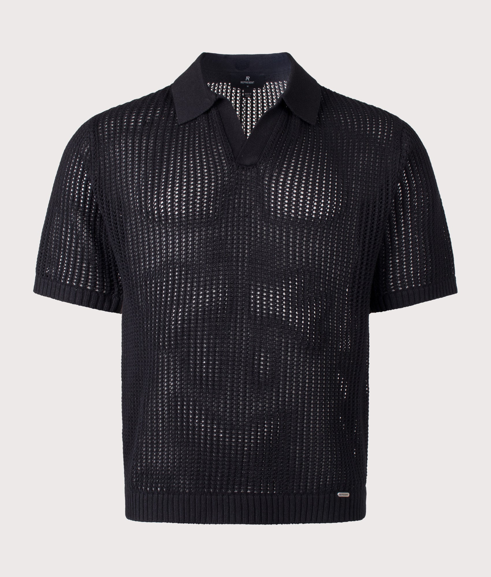 REPRESENT Beverly Open Gauge Knitted Polo Shirt in Jet Black at EQVVS Menswear. Front shot.