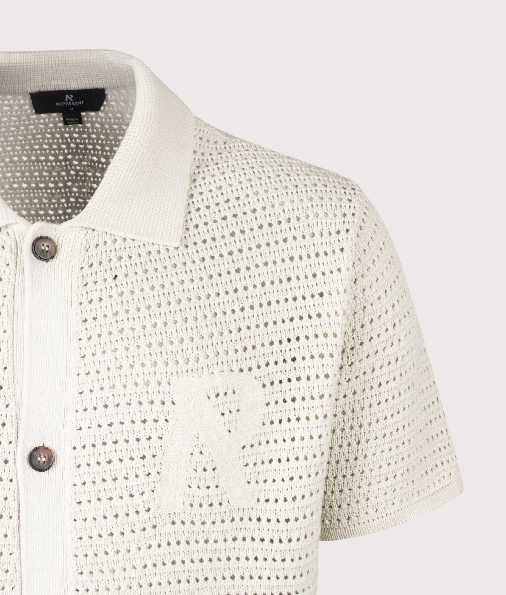 REPRESENT Pico Knit Polo Shirt in Ecru at EQVVS Menswear. Detail shot.
