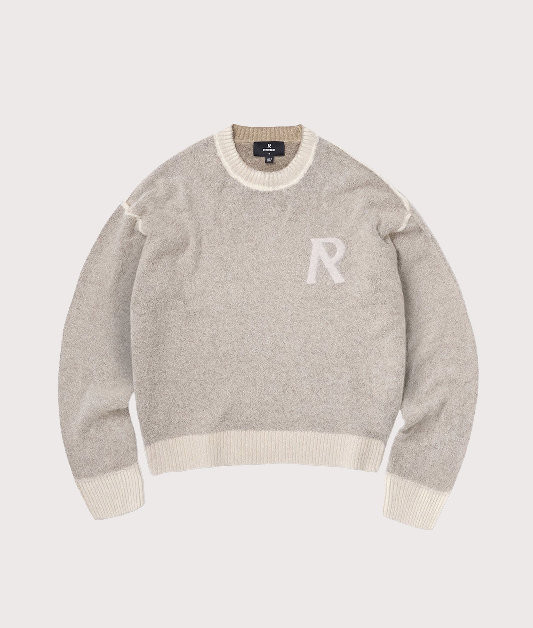 Represent Laurel Alpaca Knitted Jumper  in Latte at EQVVS Menswear. Flat front shot.