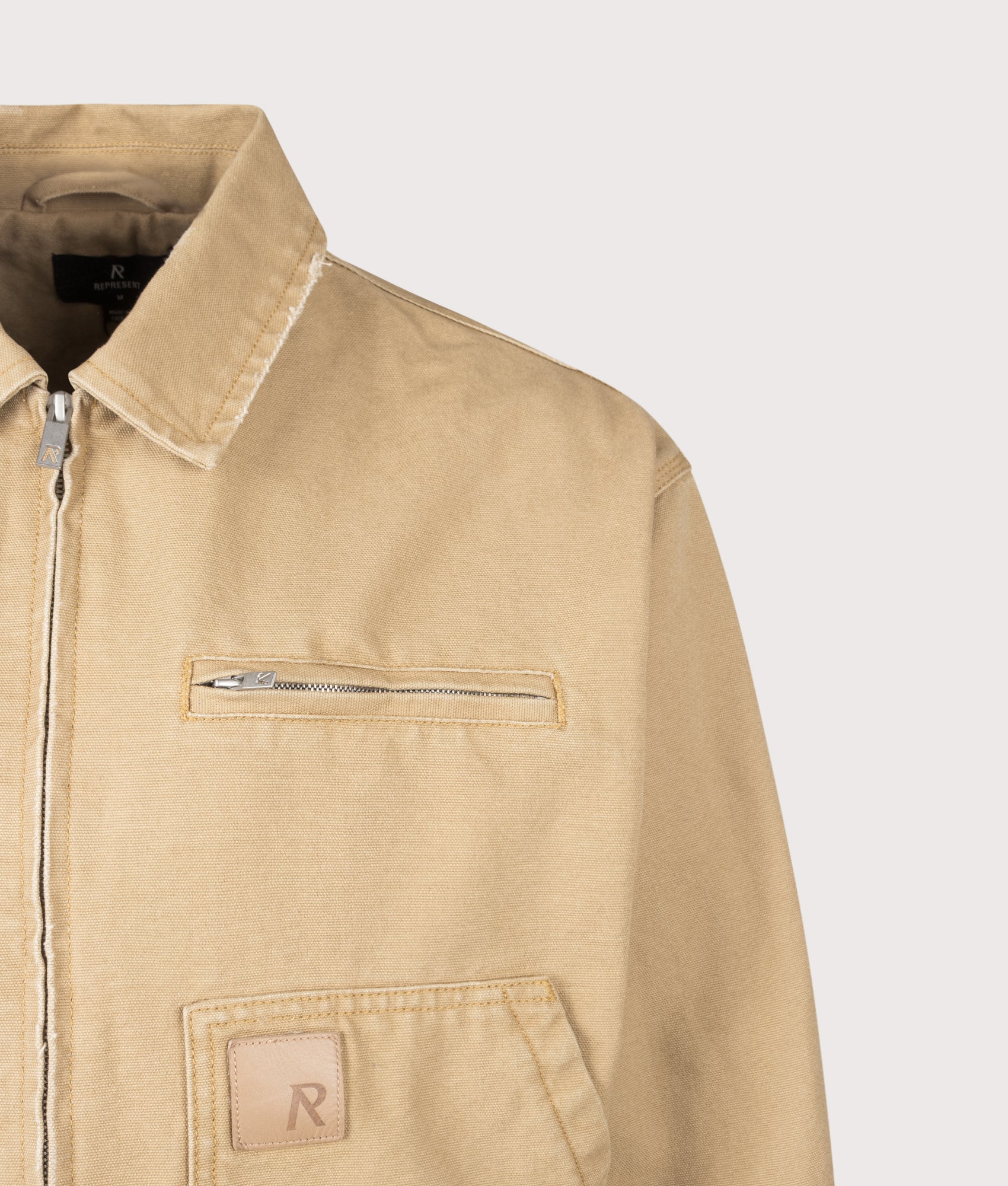 Workwear Jacket in Washed Tan by REPRESENT. Shot by EQVVS. Detail shot.