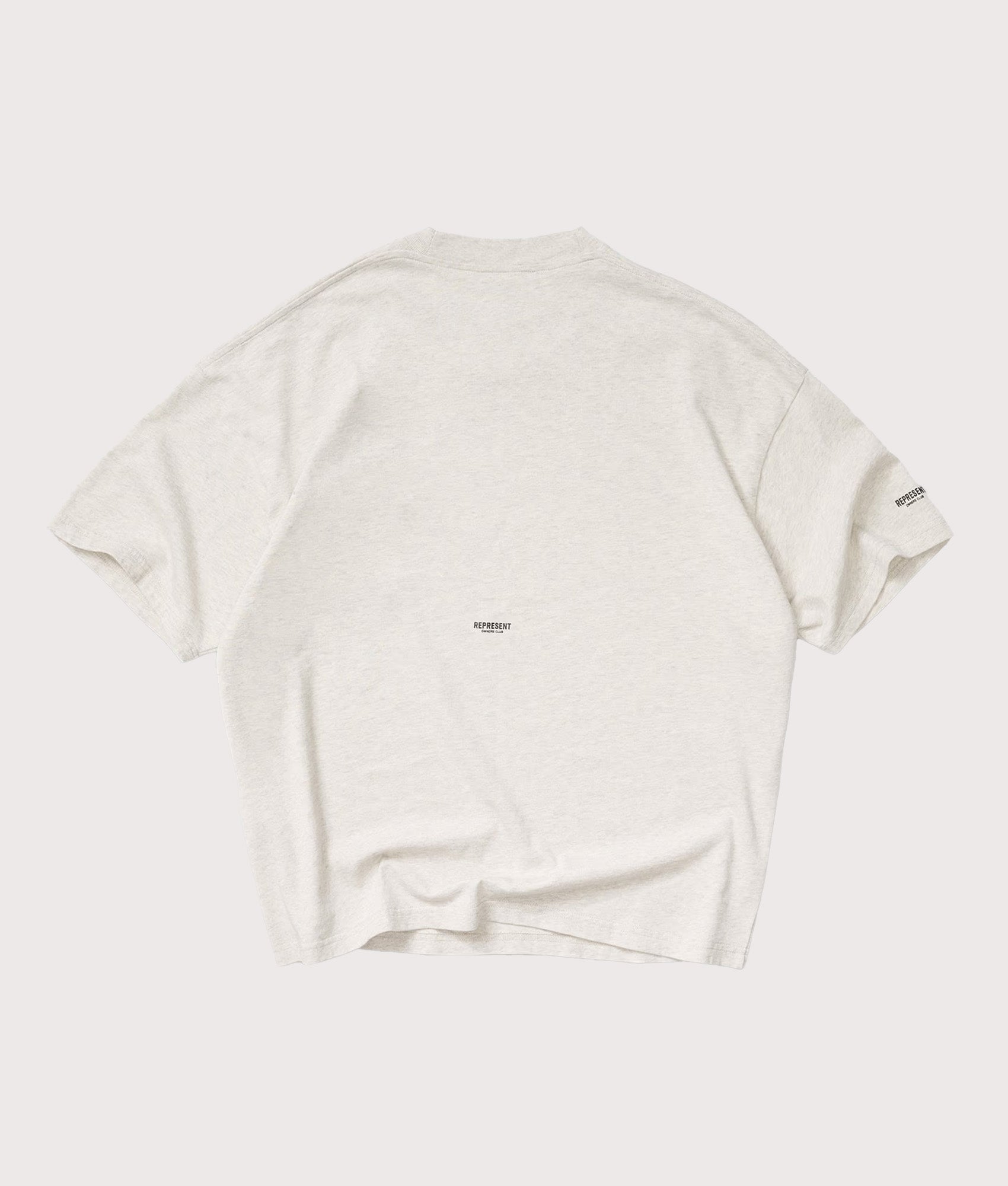 Represent Oversized Micro Owners Club T-Shirt in Cream Marl at EQVVS Menswear. Back shot.