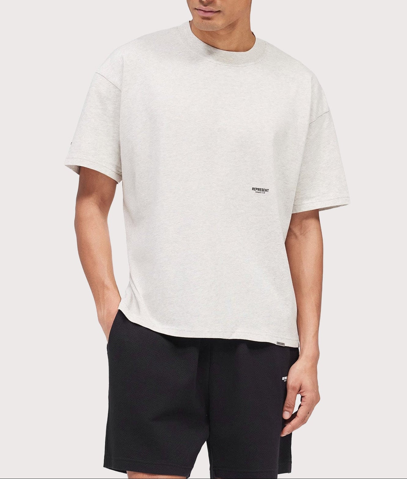 Represent Oversized Micro Owners Club T-Shirt in Cream Marl at EQVVS Menswear. Model front shot.