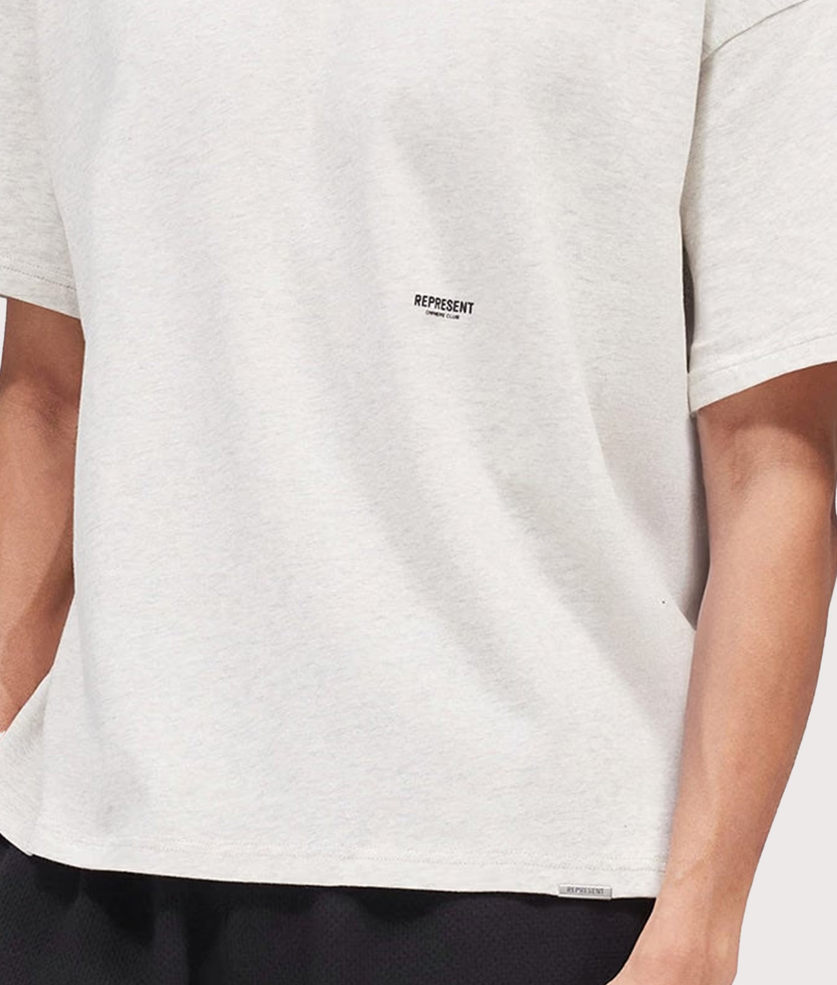 Represent Oversized Micro Owners Club T-Shirt in Cream Marl at EQVVS Menswear. Detail shot.