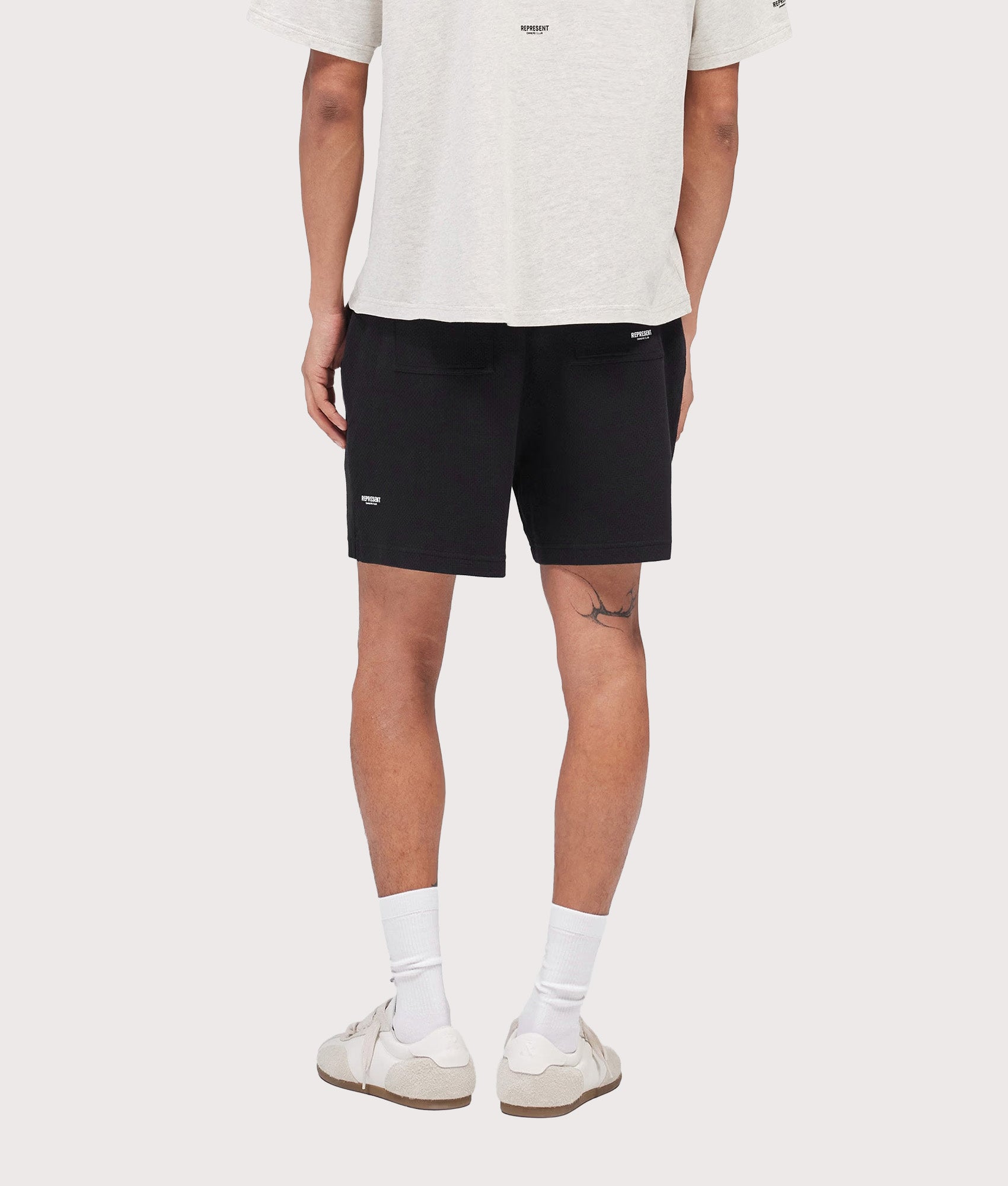 Represent Relaxed fit Micro Owners Club Shorts in Black at EQVVS Menswear. Model back shot.