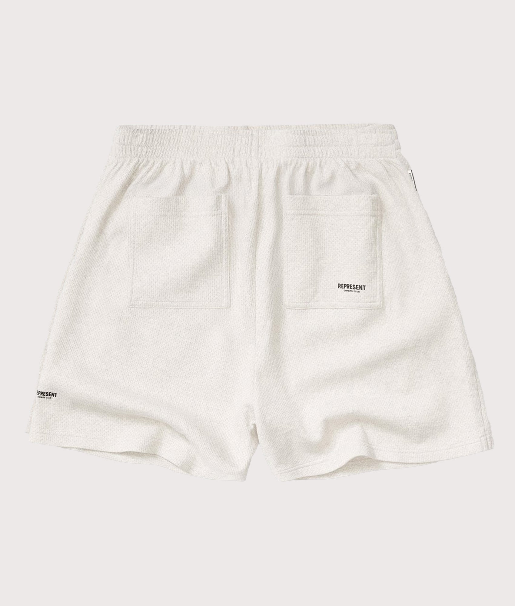 Represent Relaxed fit Micro Owners Club Shorts in Cream Marl at EQVVS Menswear. Back shot.