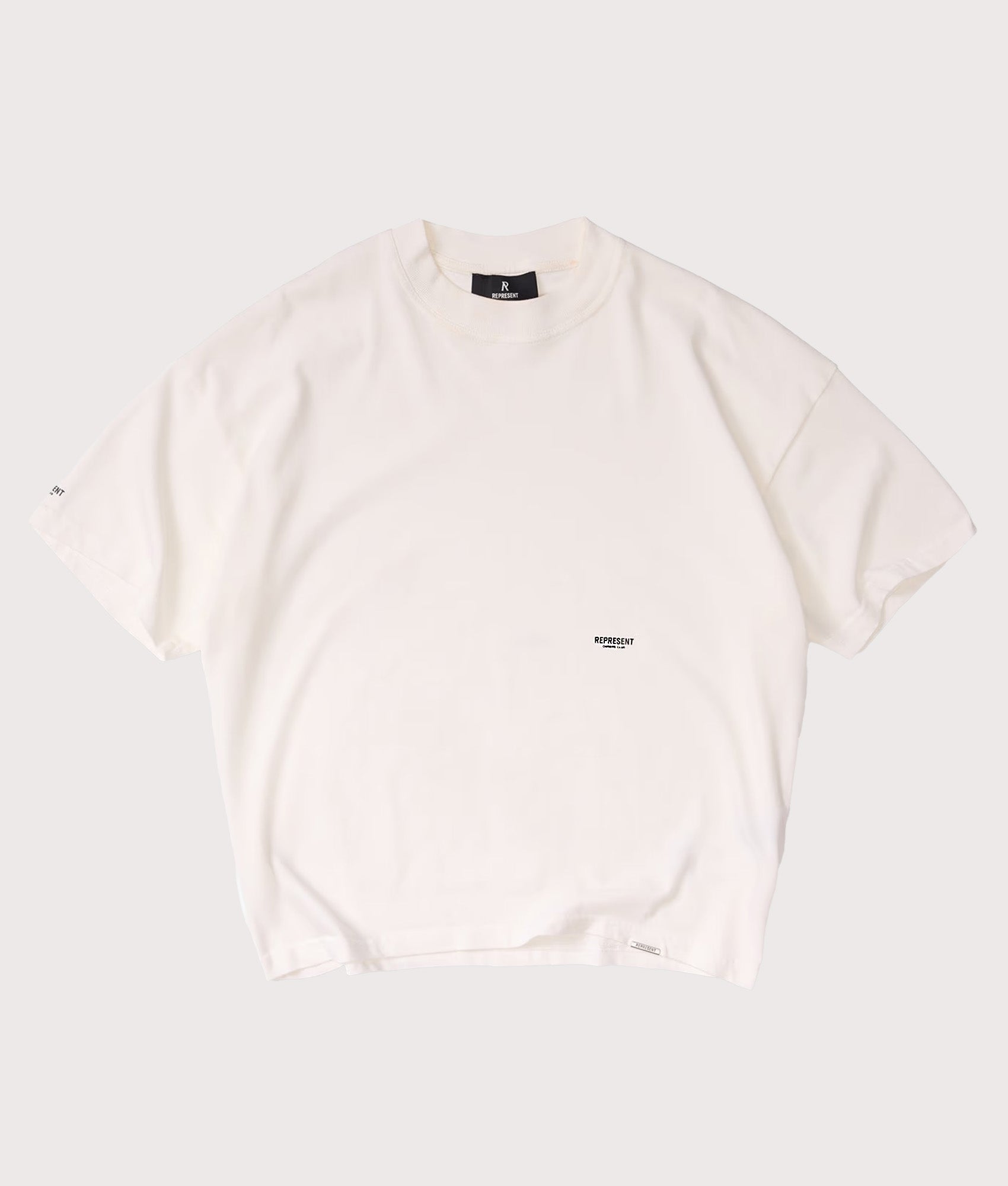 Represent Oversized Micro Owners Club T-Shirt in Flat White at EQVVS Menswear. Front shot.