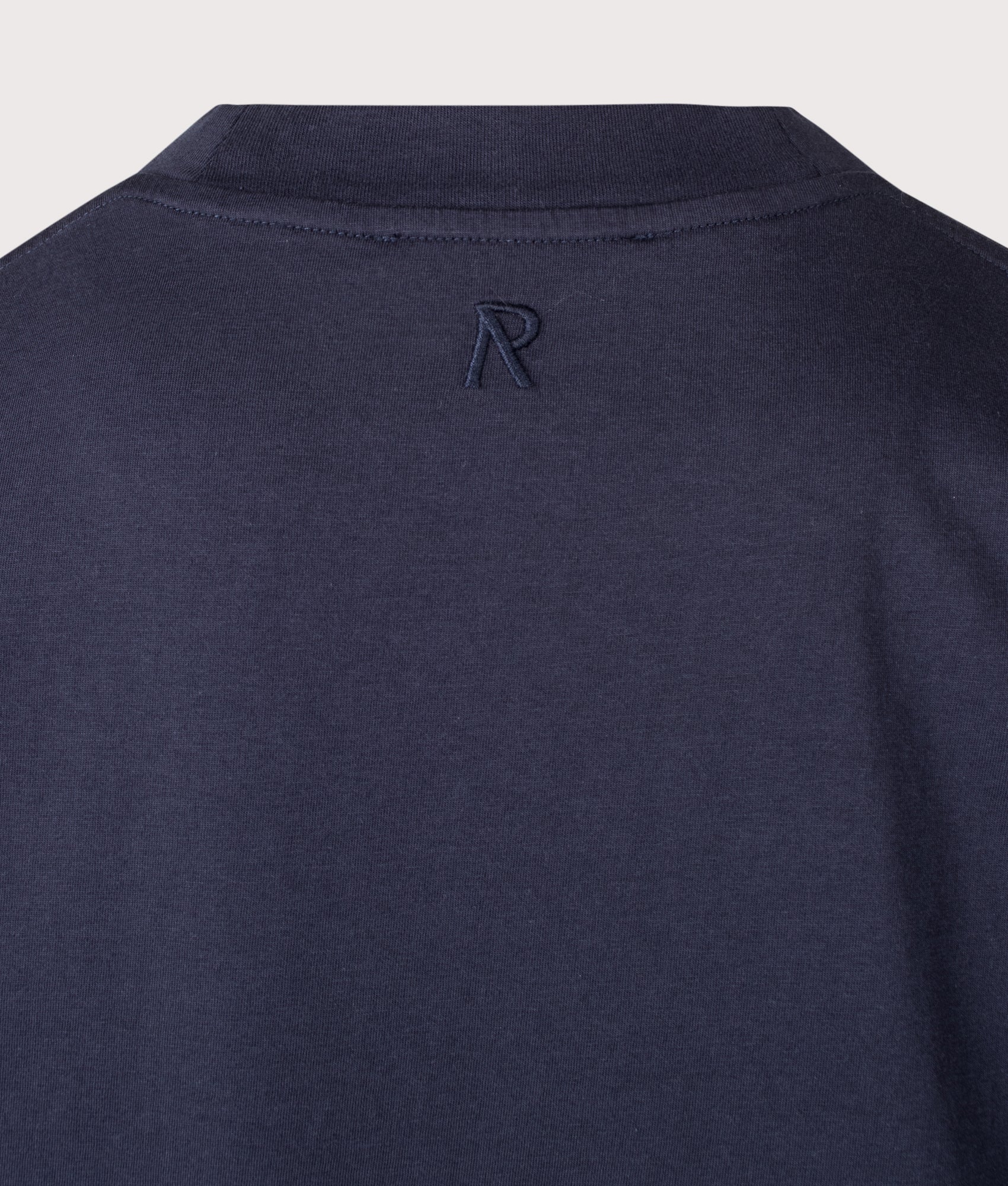 Represent Oversized Initial T-Shirt in Midnight Navy at EQVVS Menswear. Detail shot.