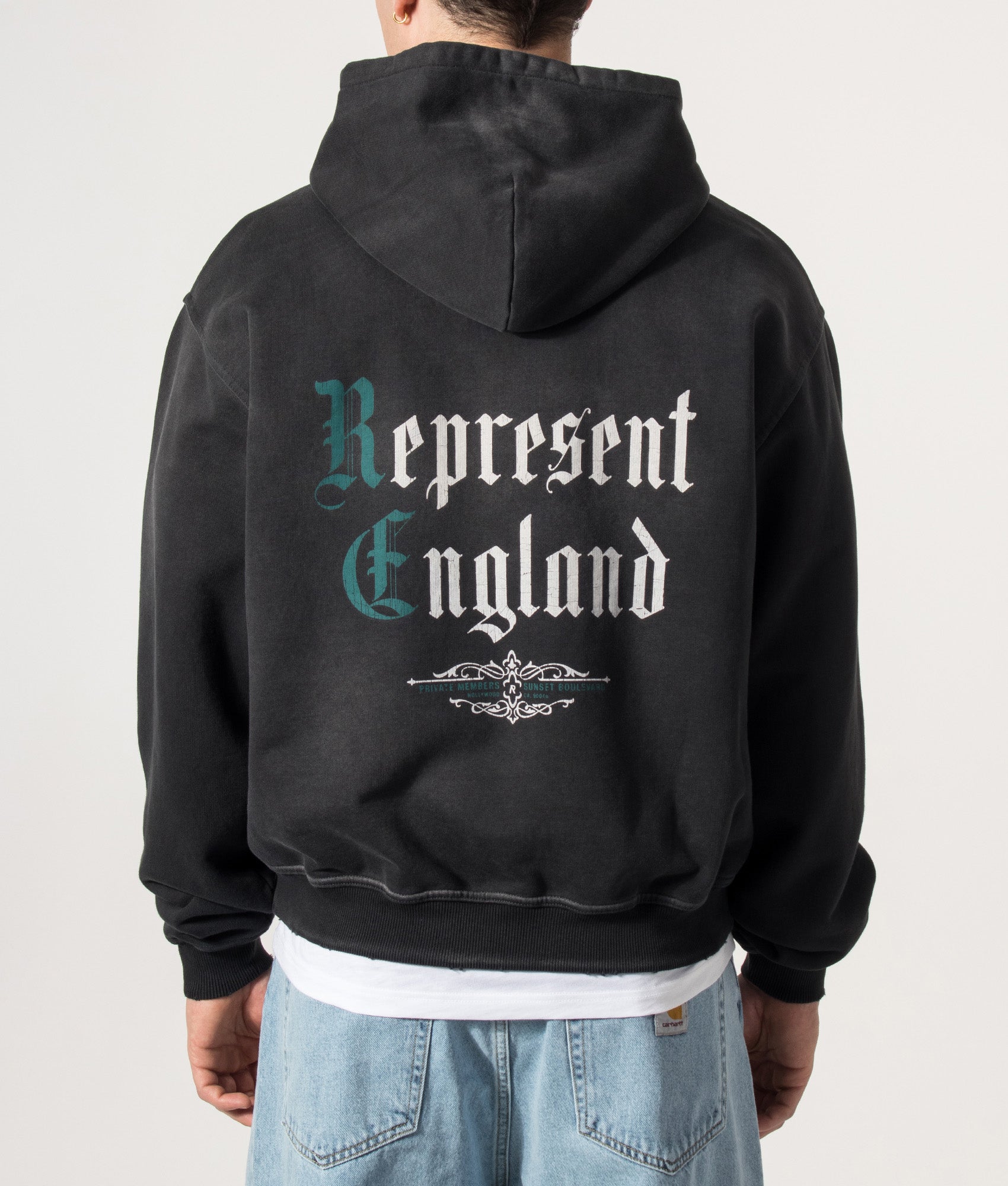Represent Oversized Fit Private Members Hoodie in Stained Black at EQVVS Menswear. Model back shot.