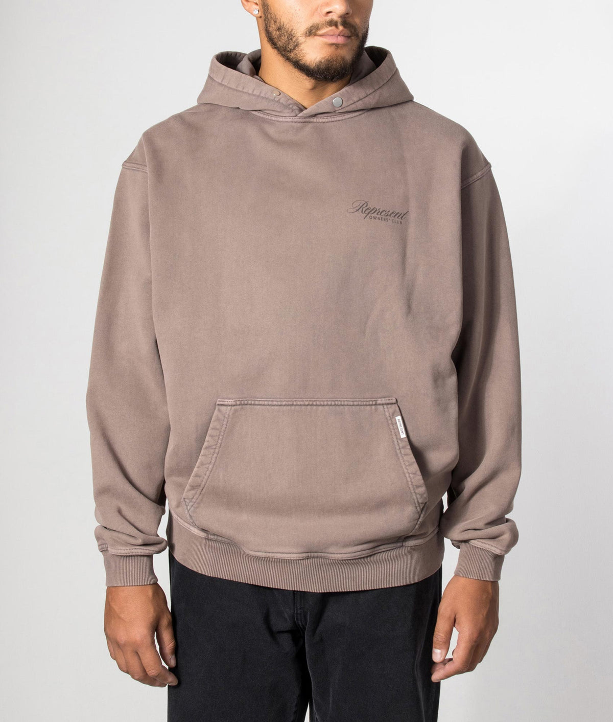 REPRESENT Owners Club Script Hoodie in Truffle at EQVVS Menswear. Model front shot.
