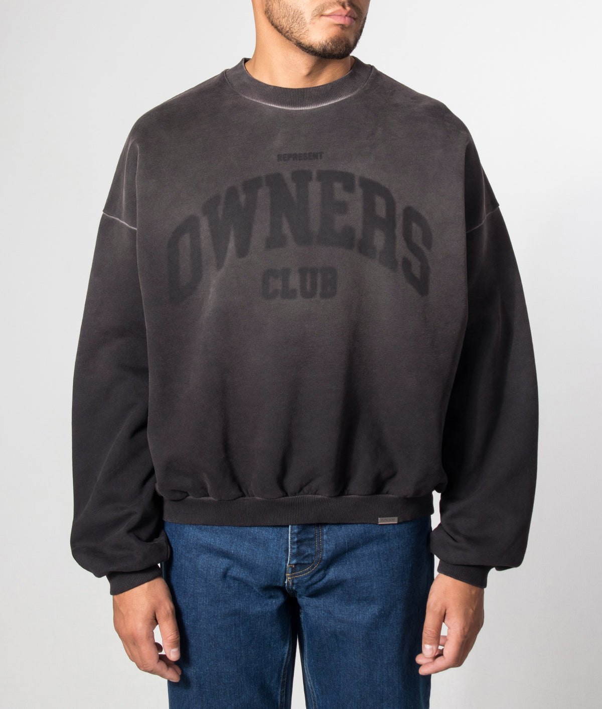 REPRESENT Oversized Fit Owners Sweatshirt in Vintage Black at EQVVS Menswear. Model front shot.