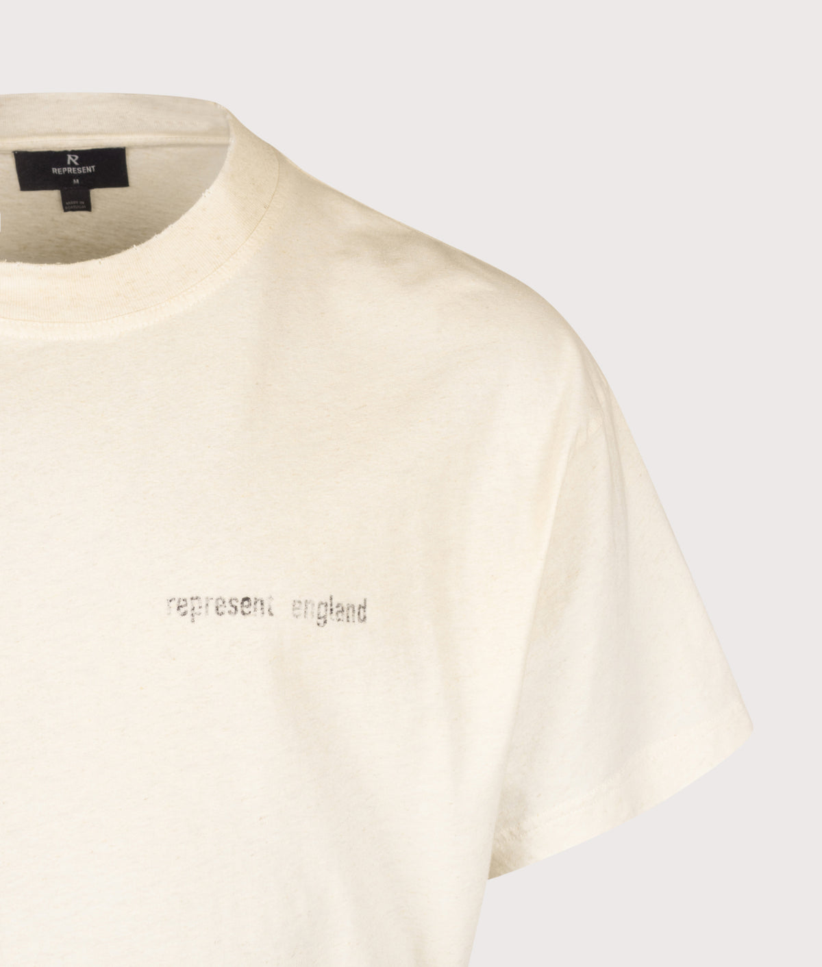 REPRESENT Oversized Box Fit Reverse Resent T-Shirt in Flat White at EQVVS Menswear. Detail shot.