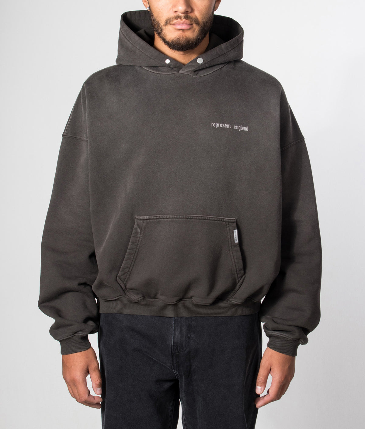 REPRESENT Oversized Fit Resent Hoodie in Ash at EQVVS Menswear. Model front shot.