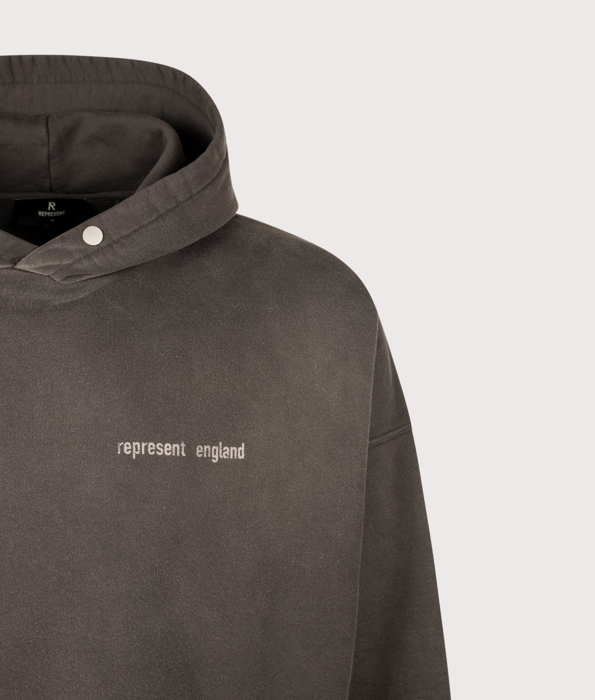 REPRESENT Oversized Fit Resent Hoodie in Ash at EQVVS Menswear. Detail shot.