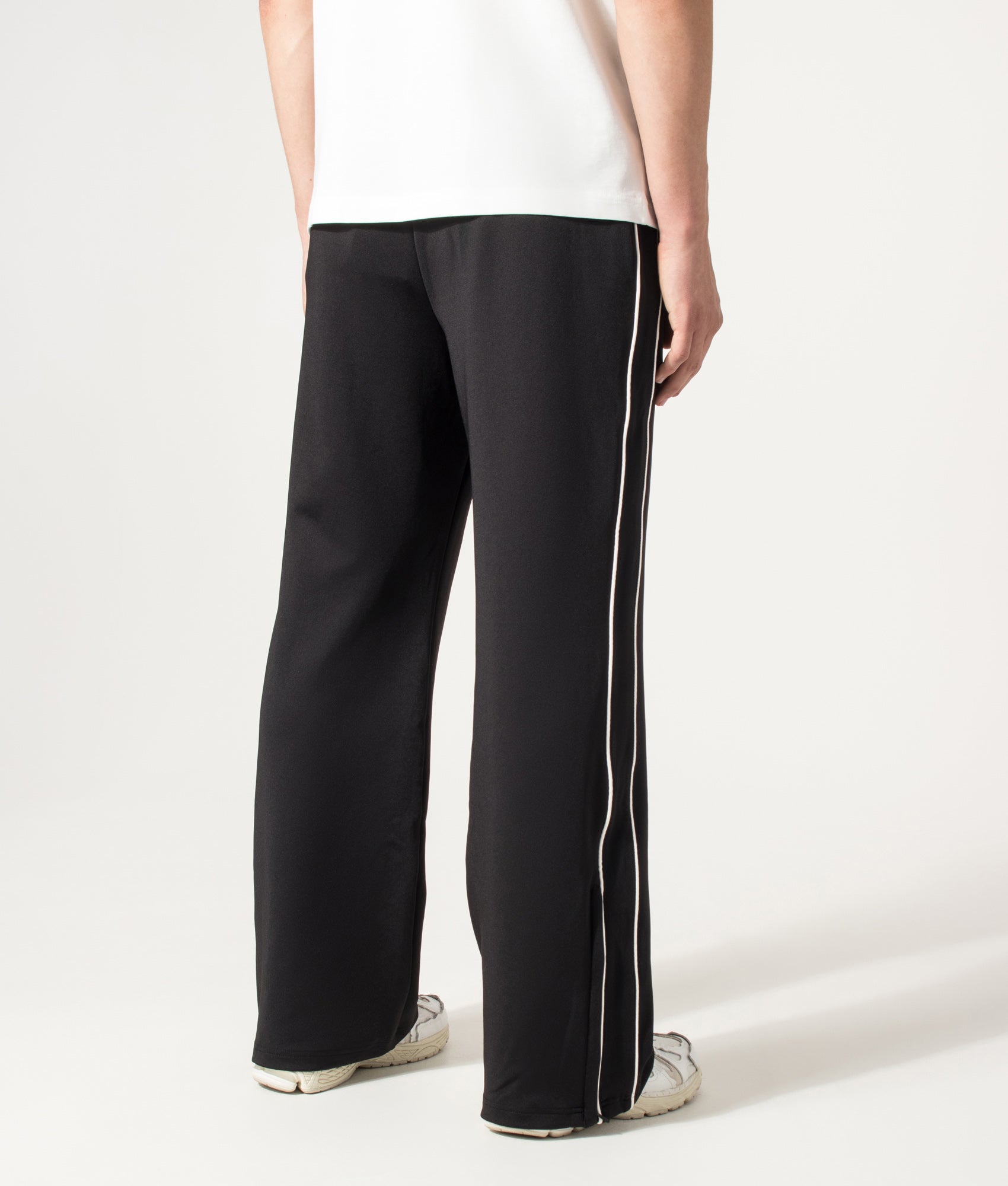 Represent Taped Track Pant in Black at EQVVS Menswear. Angled back shot.