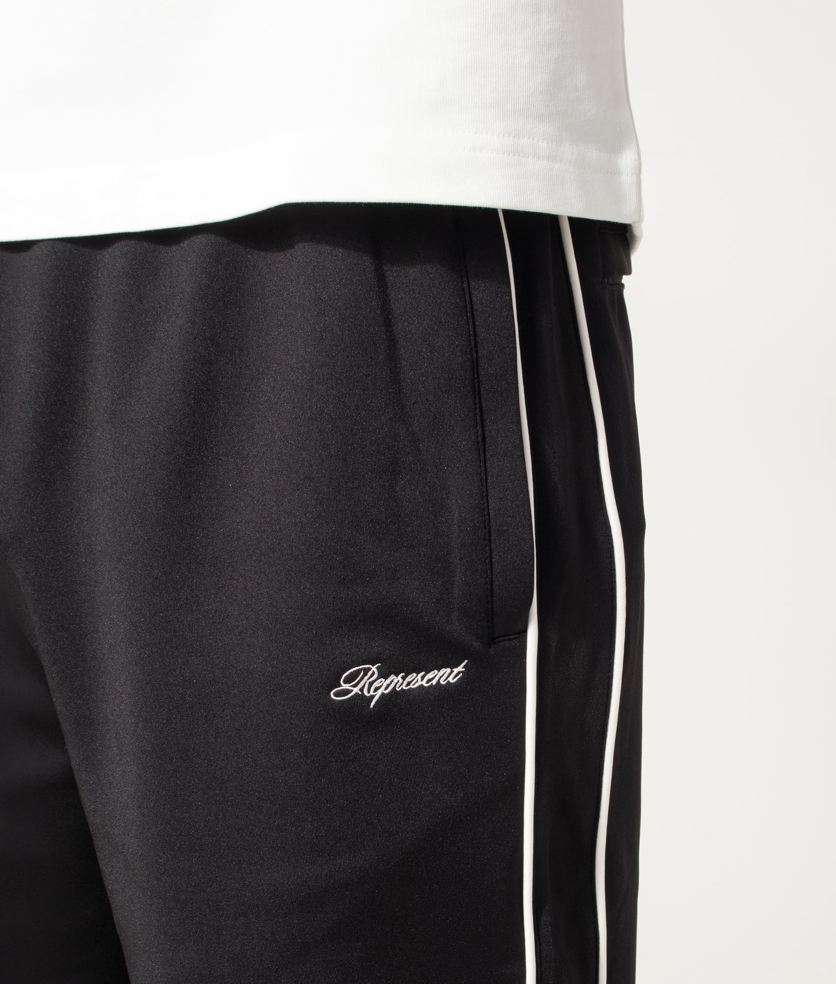 Represent Taped Track Pant in Black at EQVVS Menswear. Detail shot.