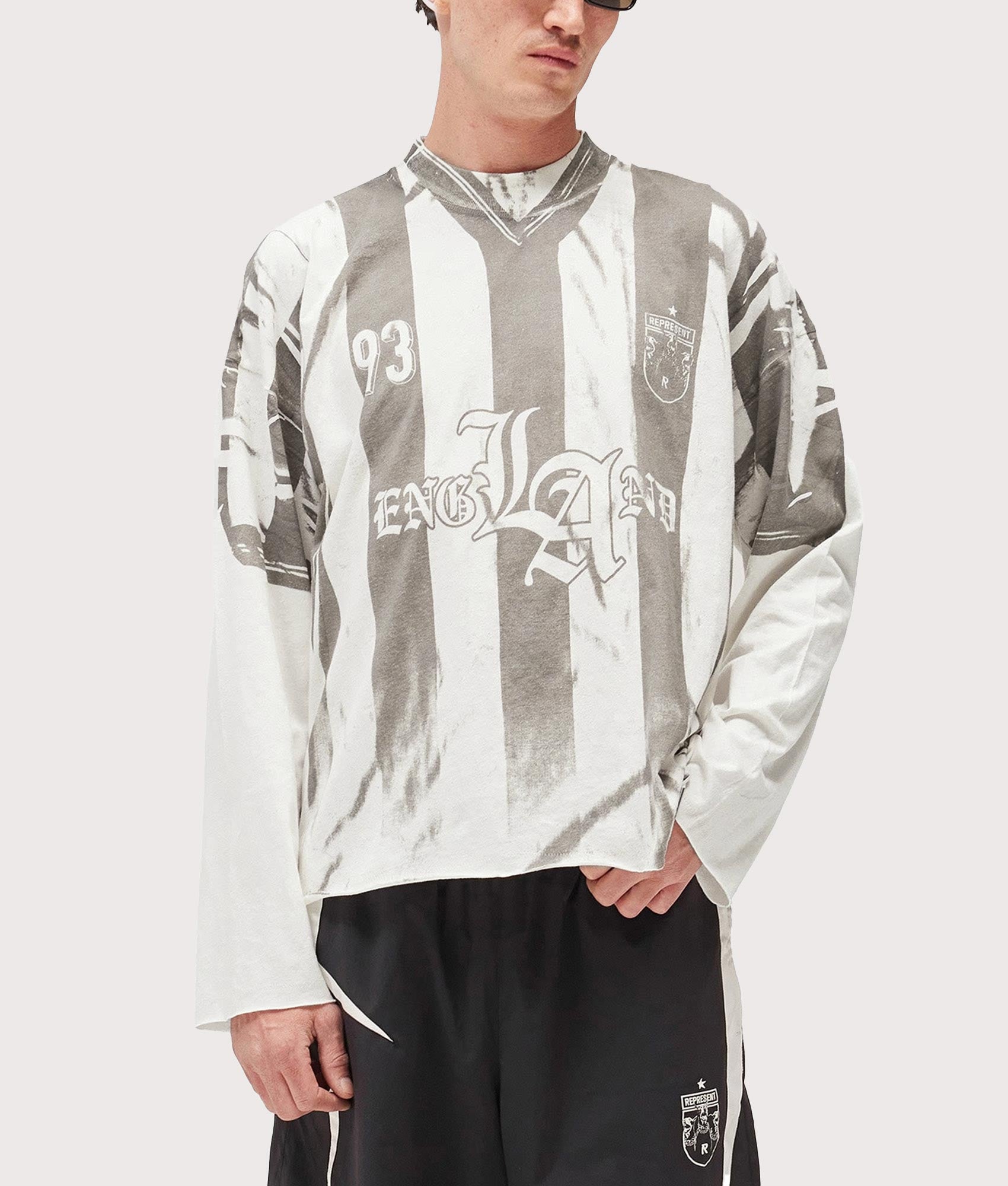 Represent Oversized Fit Printed LS Football Top in Flat White at EQVVS Menswear. Front shot.
