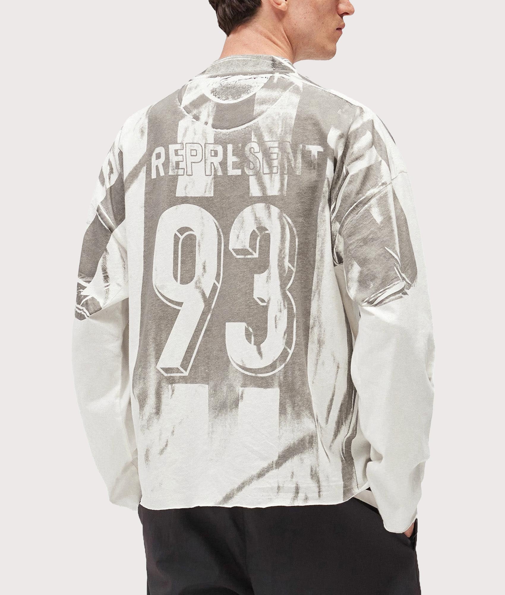 Represent Oversized Fit Printed LS Football Top in Flat White at EQVVS Menswear. Back shot.